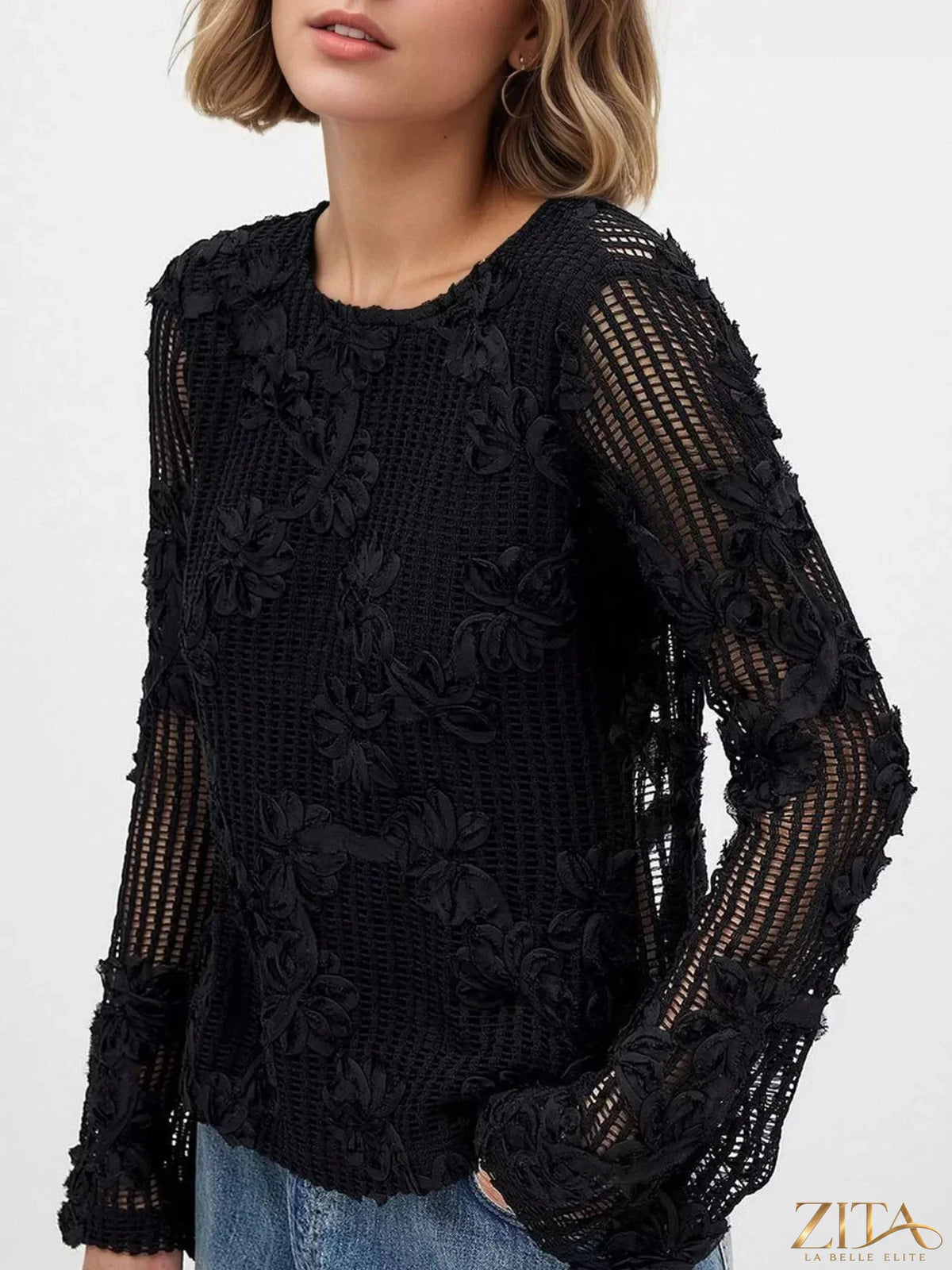 Zita La Belle Elite openwork tied-back long sleeve blouse with intricate lace details and a stylish back tie design.
