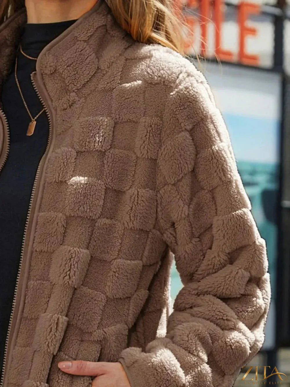 Zita La Belle Elite fuzzy checkered zip-up jacket with soft texture and stylish pattern, shown in a close-up image.