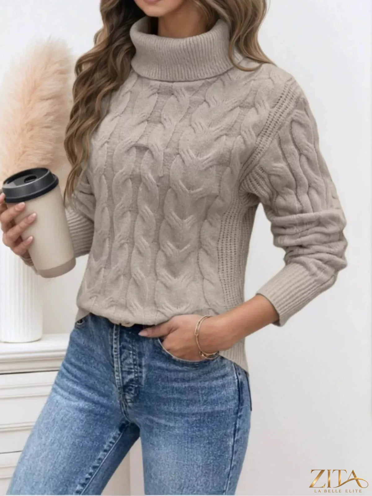Zita La Belle Elite cable-knit turtleneck sweater in neutral color, featuring a cozy, textured knit design for stylish warmth.
