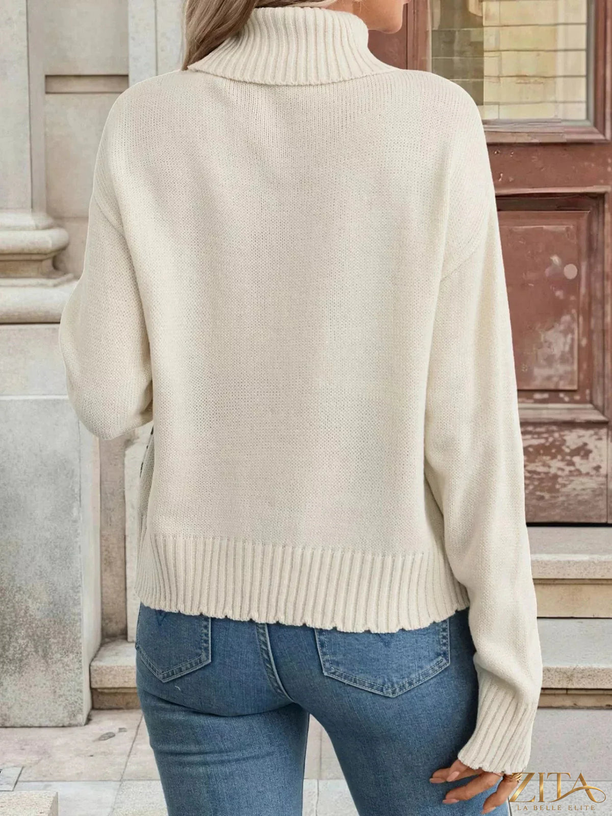 Cable knit turtleneck sweater by Trendsi, featuring a cozy, textured design and high neckline, perfect for winter wear.