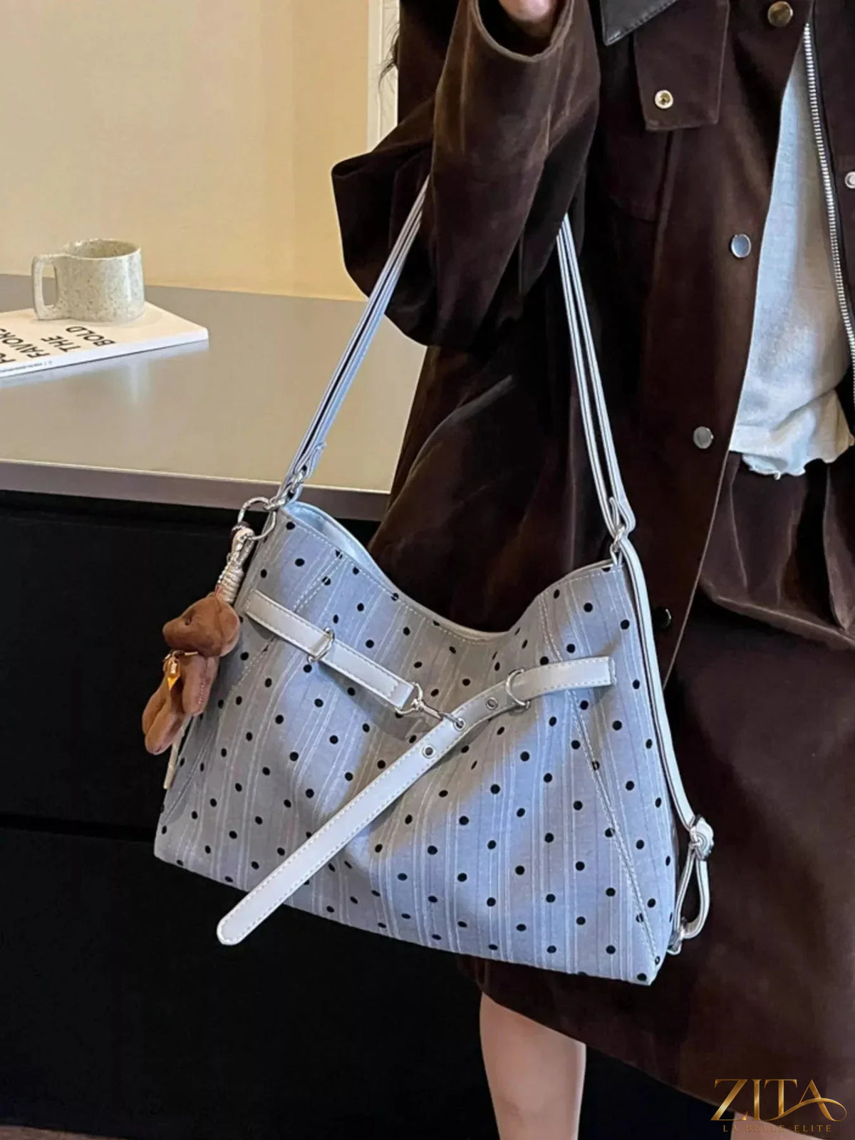 Zita La Belle Elite polka dot shoulder bag with black and white pattern, featuring a sleek strap and compact design.