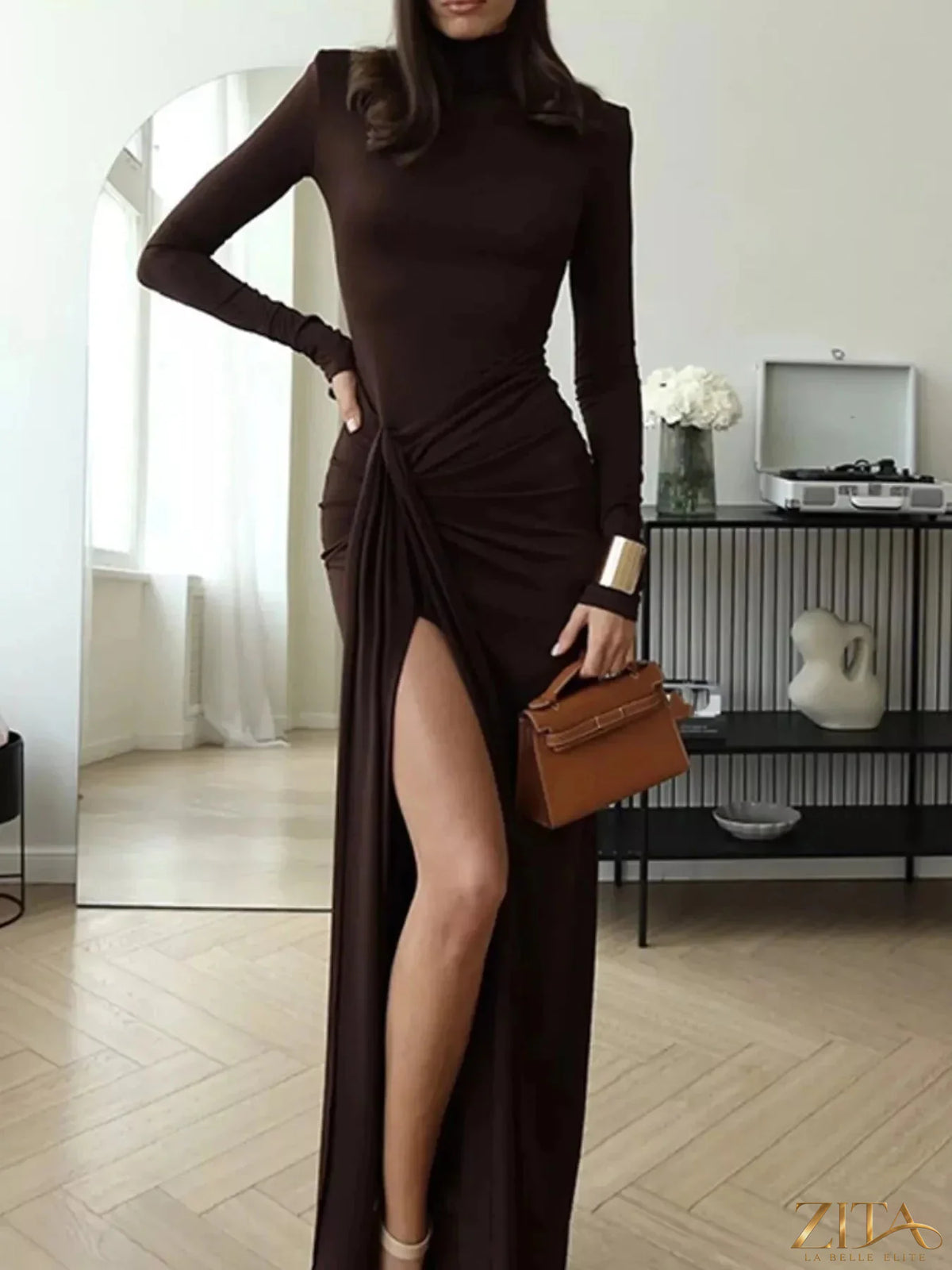 Black turtleneck long sleeve slit maxi dress by Trendsi, featuring a fitted top and flowing skirt, perfect for elegant occasions.