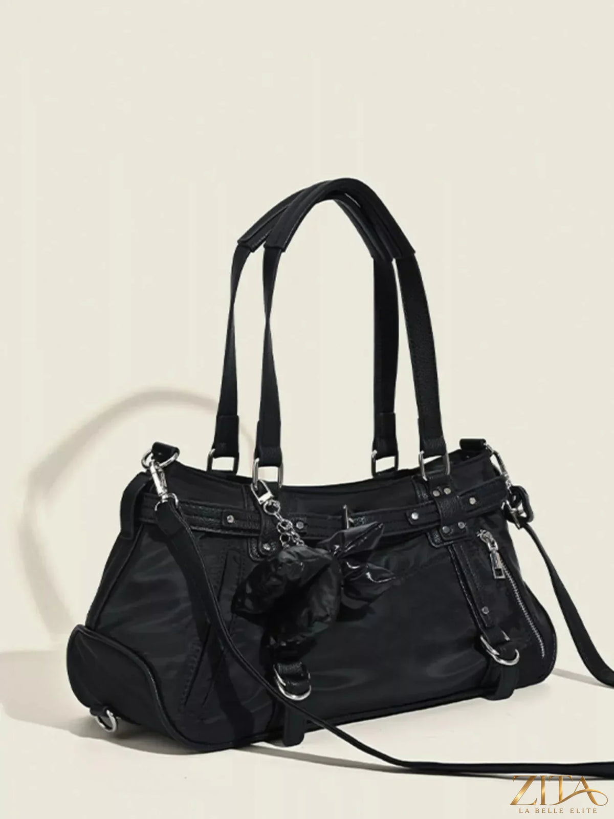Brown leather handbag with buckle decor and trendy design, featuring a sleek strap and stylish accents.