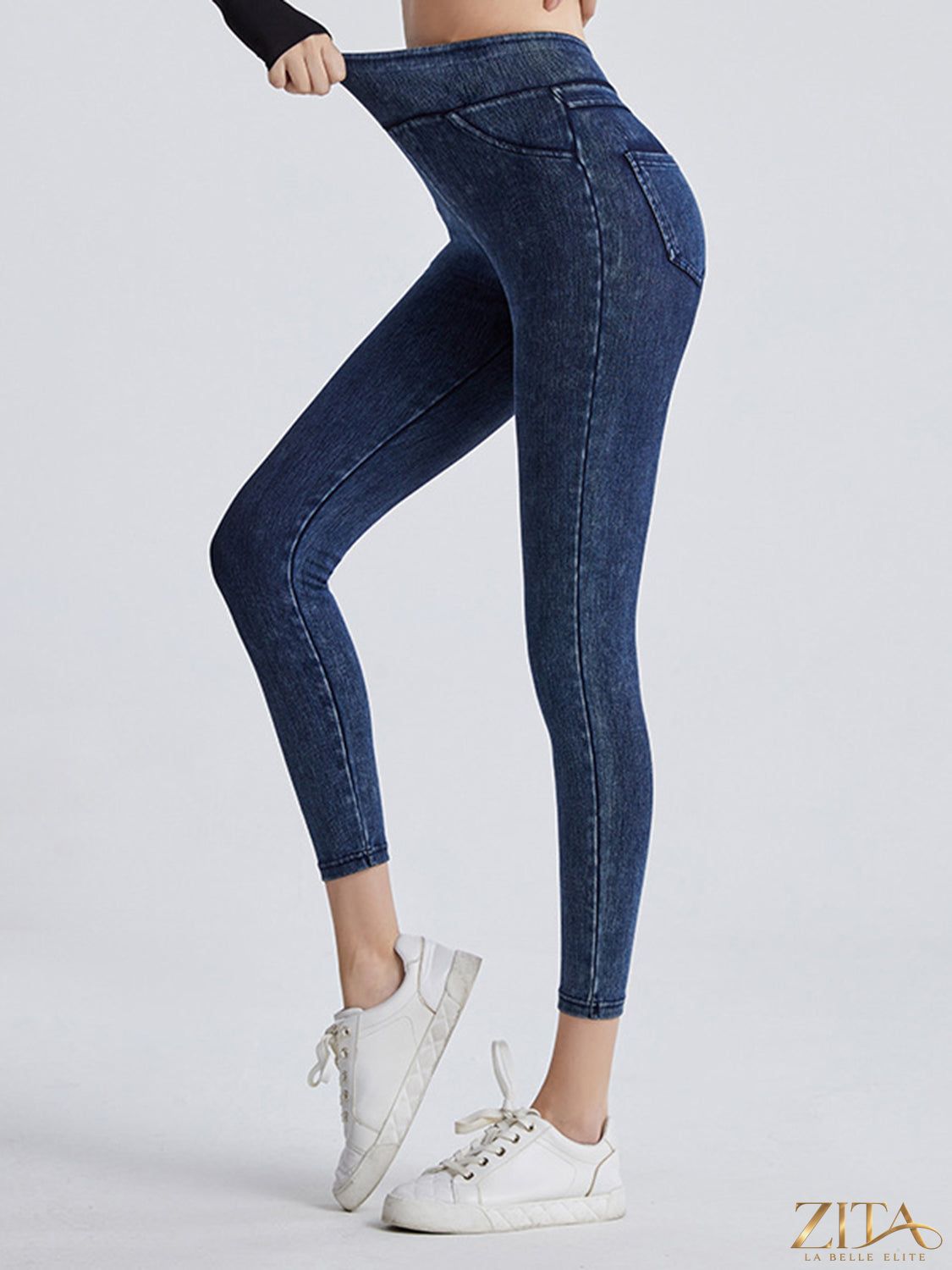 High-waisted Trendsi sports leggings with a wide waistband, made from stretchy athletic fabric for comfortable active wear.