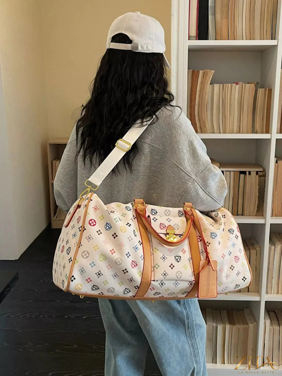 Printed leather travel bag by Trendsi with spacious interior, sturdy handles, and stylish design for convenient travel.