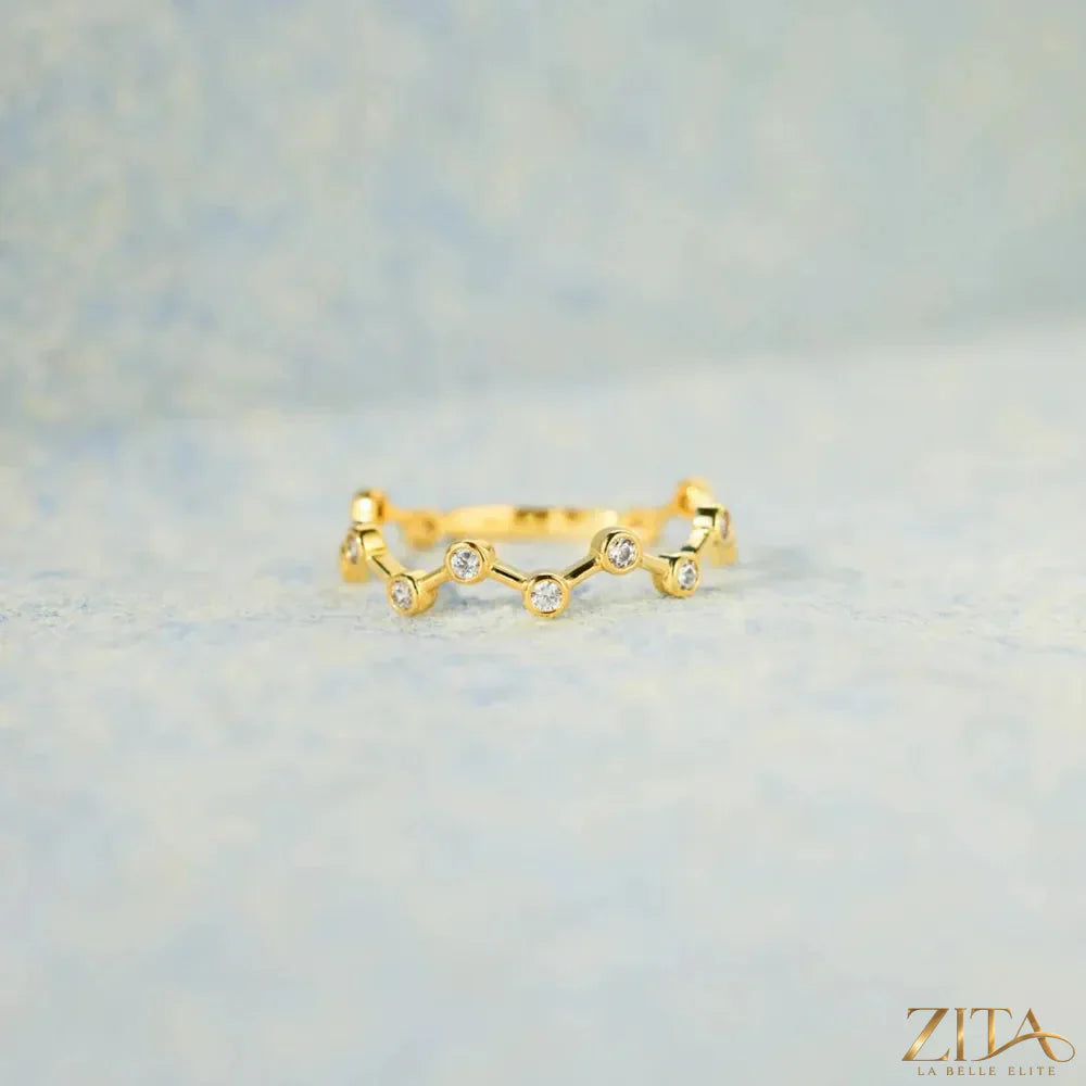 18K gold-plated sterling silver zircon ring by Zita La Belle Elite with sparkling gemstone and intricate band design.