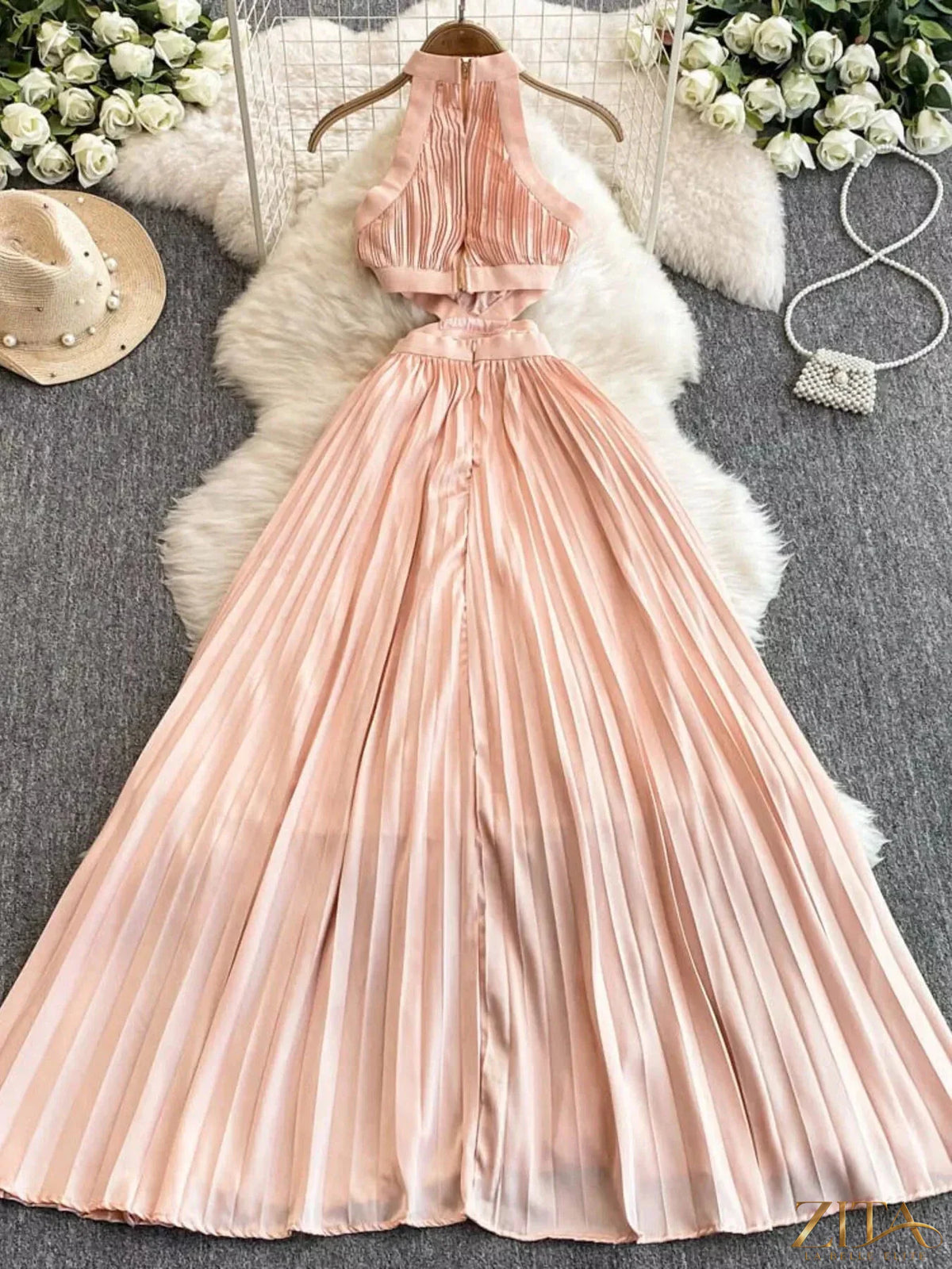 Zita La Belle Elite halter neck pleated maxi dress in flowing fabric, featuring a fitted bodice and full-length skirt.