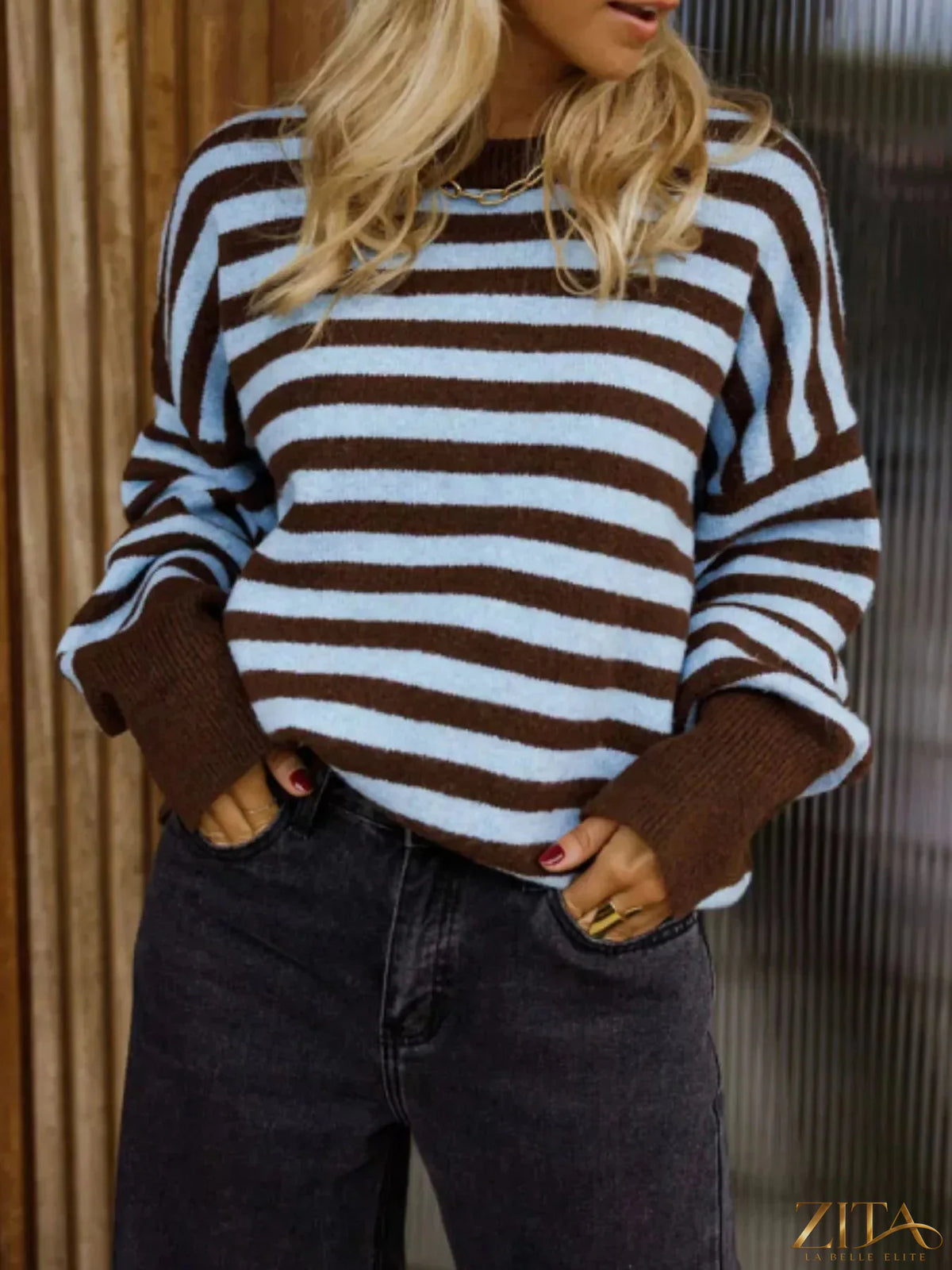 Striped crew neck sweater by Trendsi featuring horizontal navy and white stripes, long sleeves, and a comfortable fit.