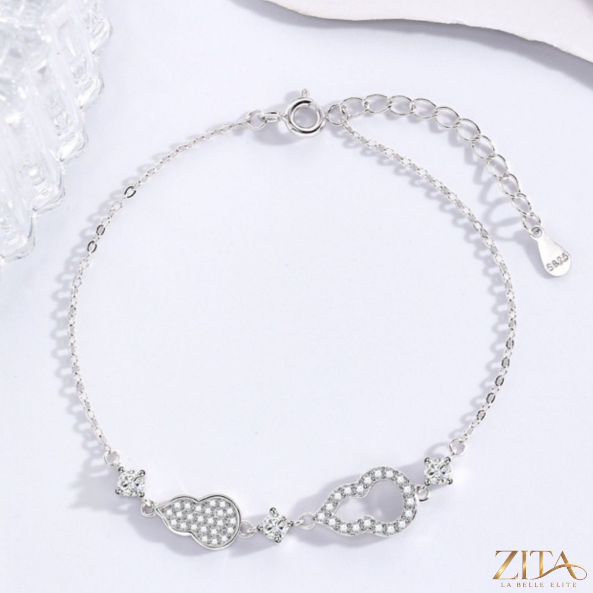 Zita La Belle Elite zircon gourd adjustable bracelet with sparkling stones and intricate design on a white background.
