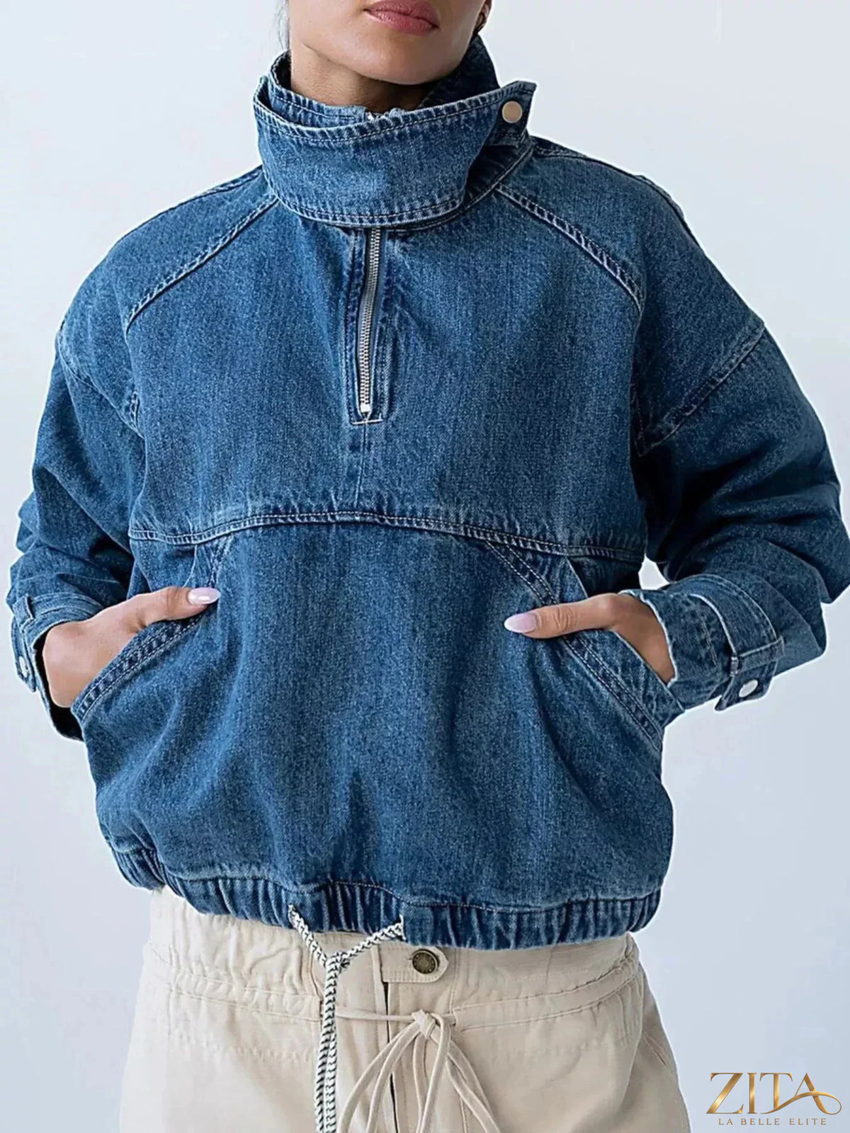 Zita La Belle Elite half-zip turtleneck denim top with long sleeves and button collar, displayed on a mannequin.