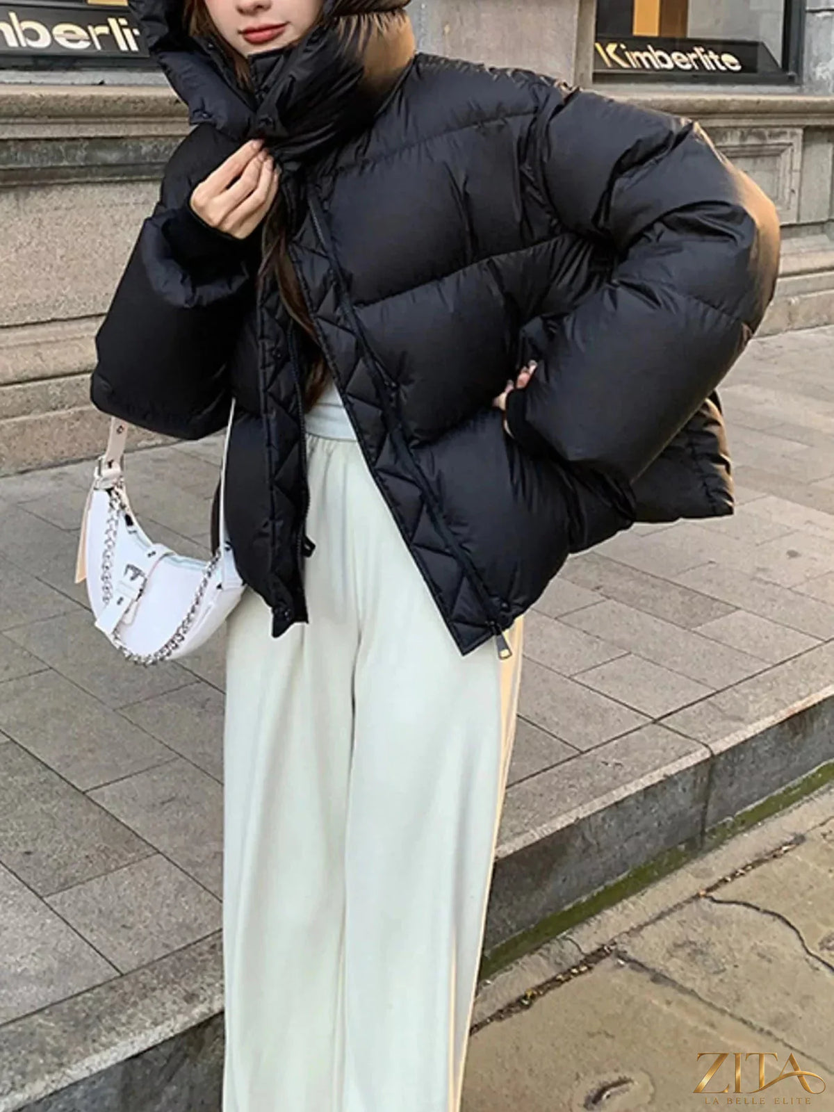 Zita La Belle Elite quilted hooded puffer jacket featuring a padded design, hood, and stylish stitching for warmth and comfort.