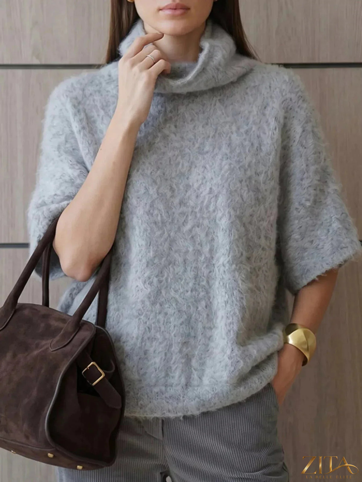 Zita La Belle Elite fuzzy short sleeve turtleneck sweater in soft, warm material with a fitted design and cozy appearance.
