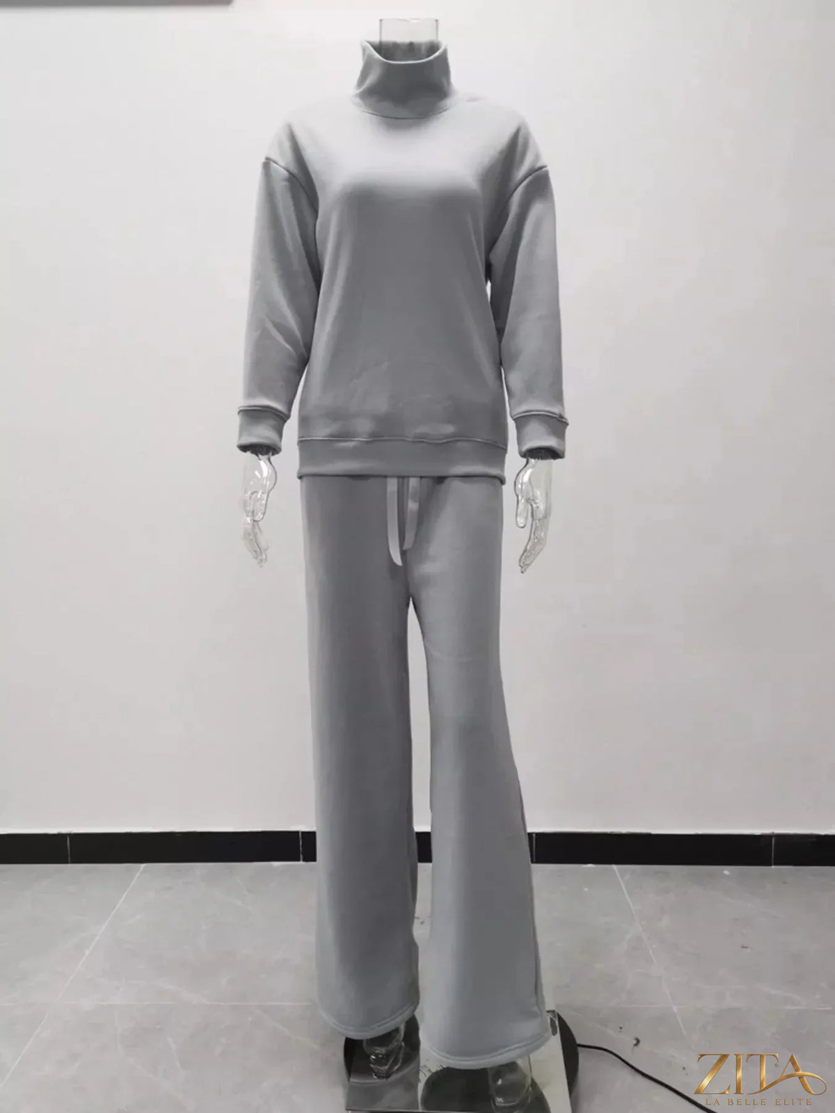 Plus size turtleneck long sleeve sweater top and matching pants set by Trendsi, in a cozy knit fabric.