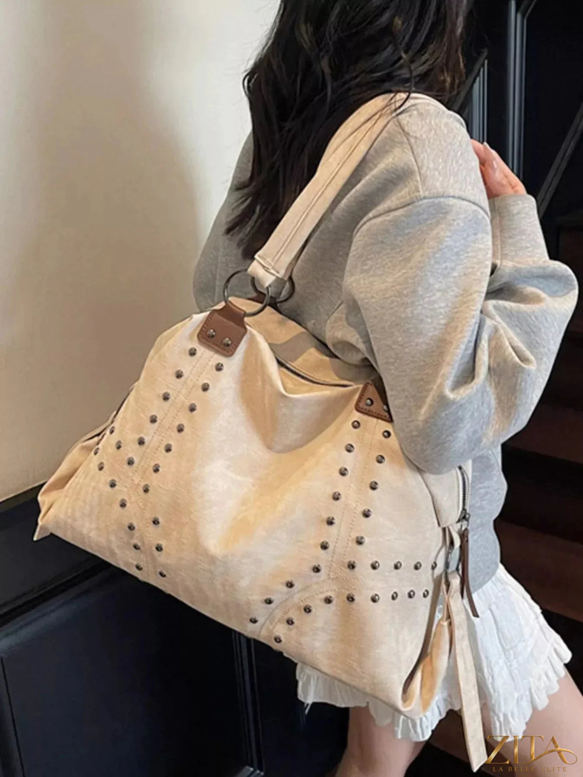 Vintage-style Zita La Belle Elite handbag with studded design, featuring a structured shape and elegant leather finish.