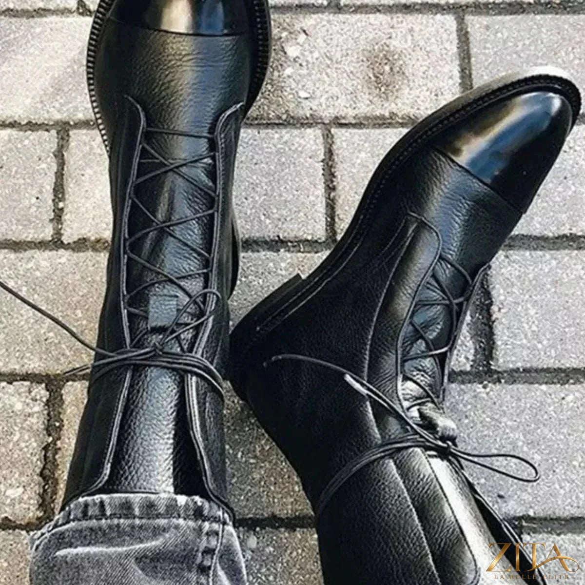 Black lace-up leather boots by Trendsi with sturdy soles and stylish design, perfect for casual or edgy outfits.