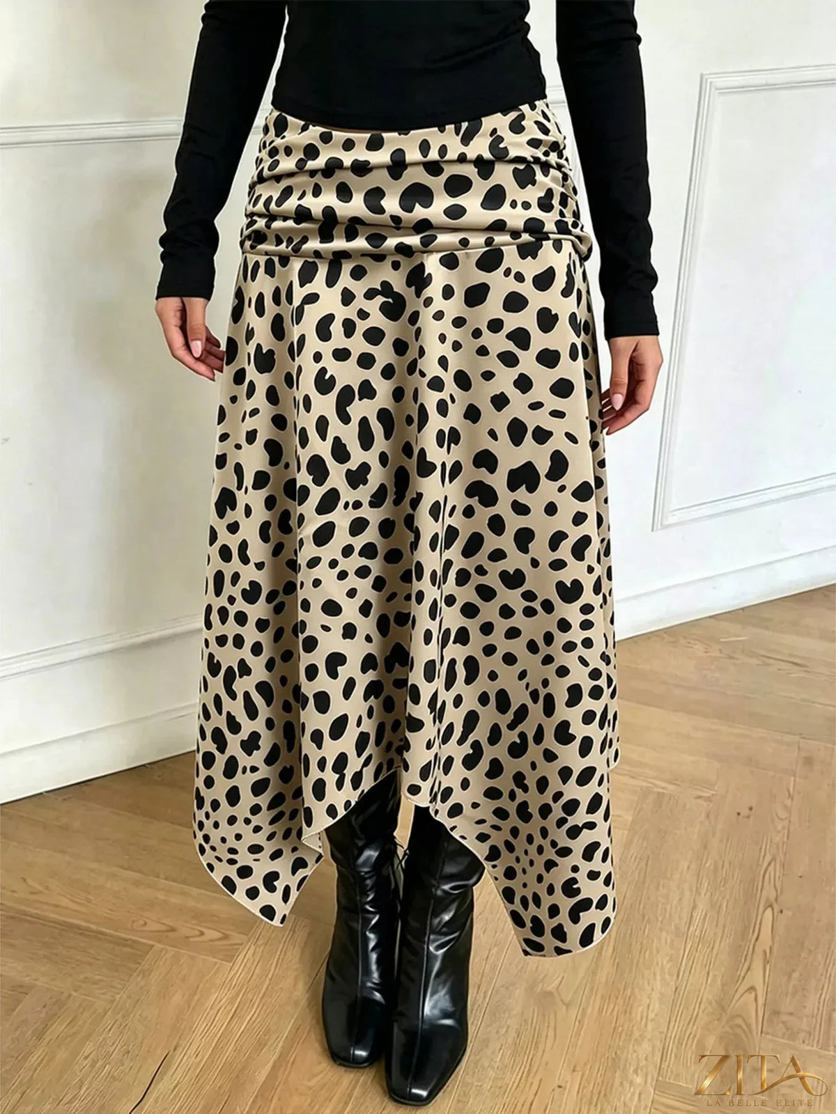 Leopard print asymmetrical hem midi skirt by Trendsi, showcasing its stylish pattern and unique hem design on a neutral background.