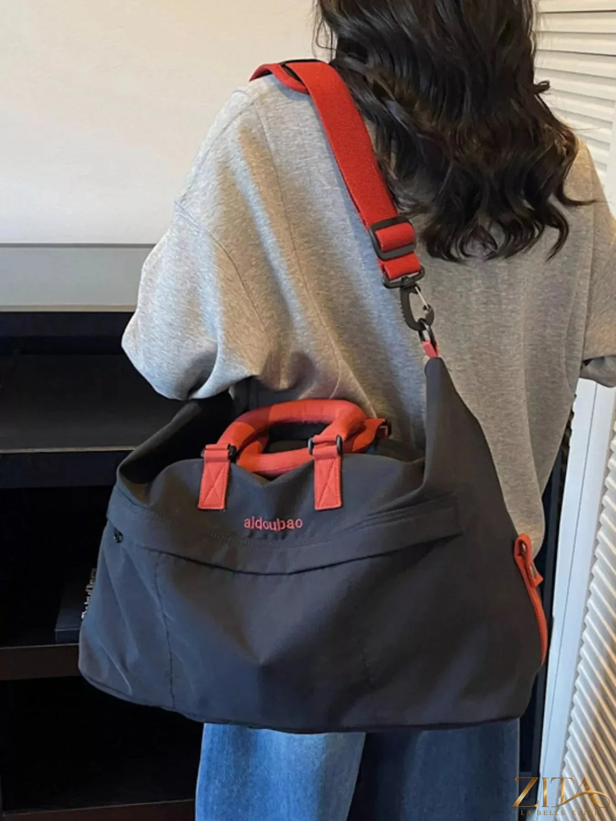 Large capacity lightweight travel bag by Zita La Belle Elite with multiple compartments and sturdy handles for easy travel.