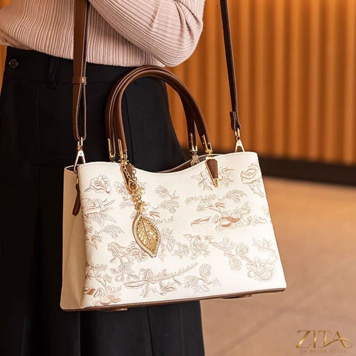 Embroidered floral leather handbag by Zita La Belle Elite with detailed floral embroidery and sleek leather design.