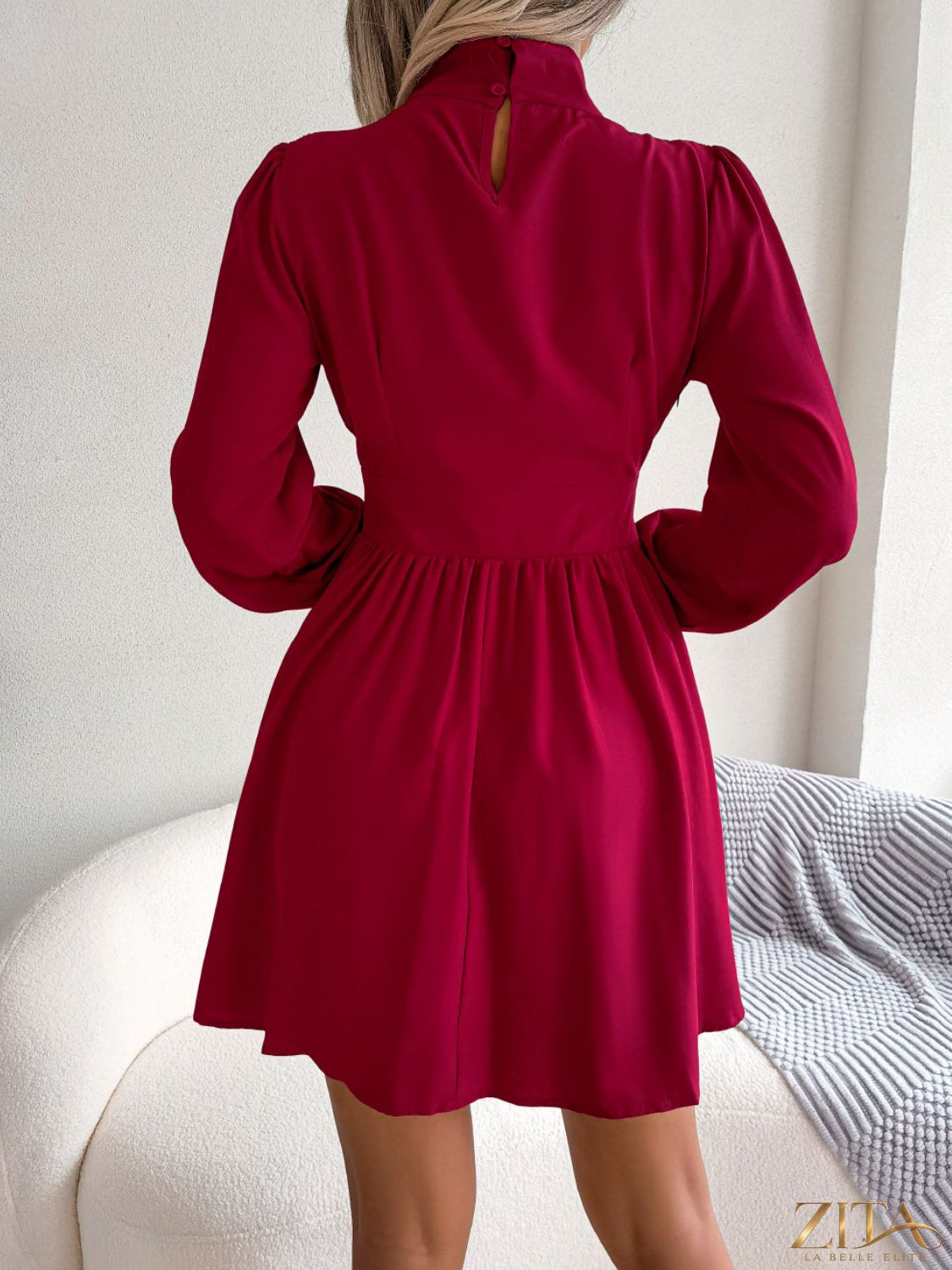 Black cutout turtleneck A-line mini dress from Trendsi featuring a fitted silhouette and stylish design.