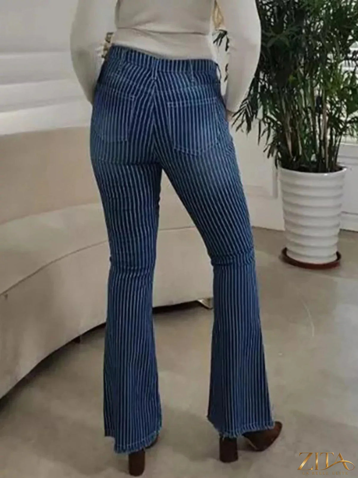 Zita La Belle Elite striped button fly flare jeans showing high-waisted fit, bold vertical stripes, and classic denim texture.