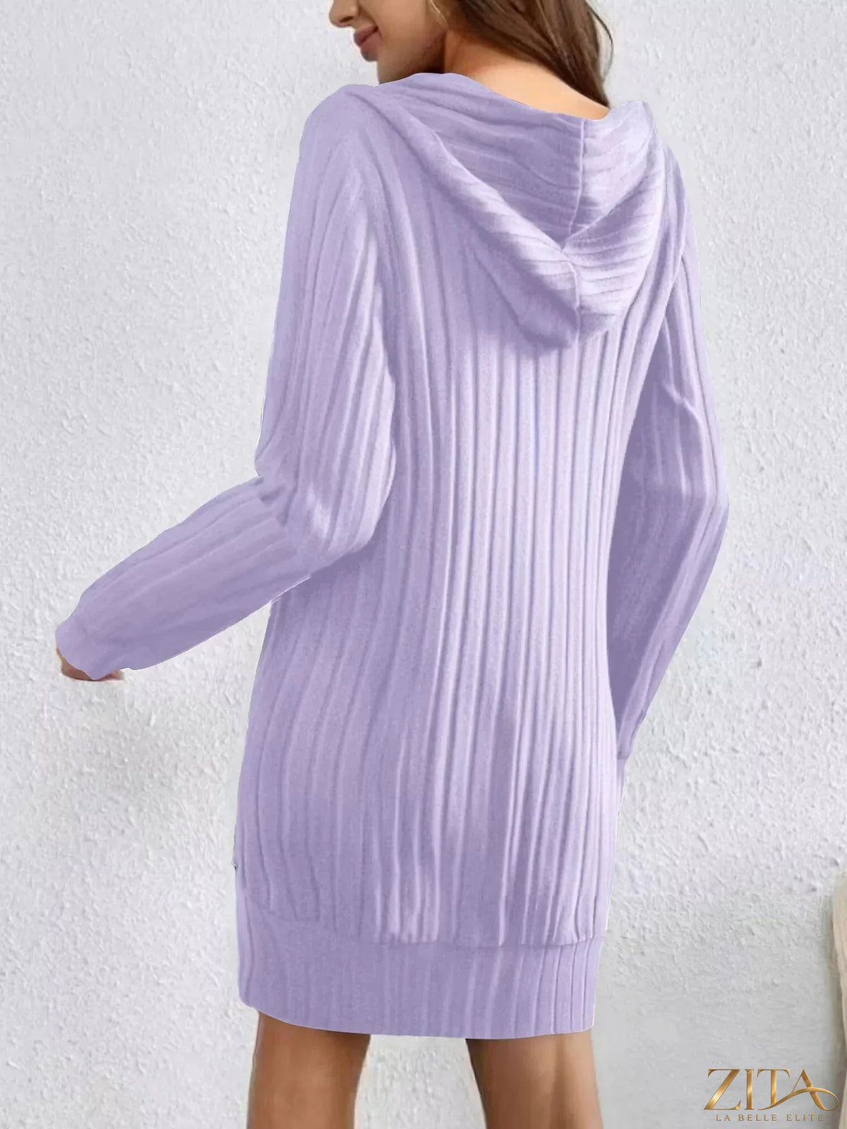 Zita La Belle Elite ribbed knit hoodie dress worn by a model, featuring a relaxed fit and soft ribbed texture.