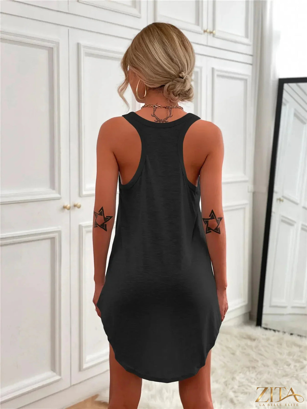 Zita La Belle Elite casual tank mini dress with curved hem, sleeveless summer dress styled for warm weather, fitted silhouette.