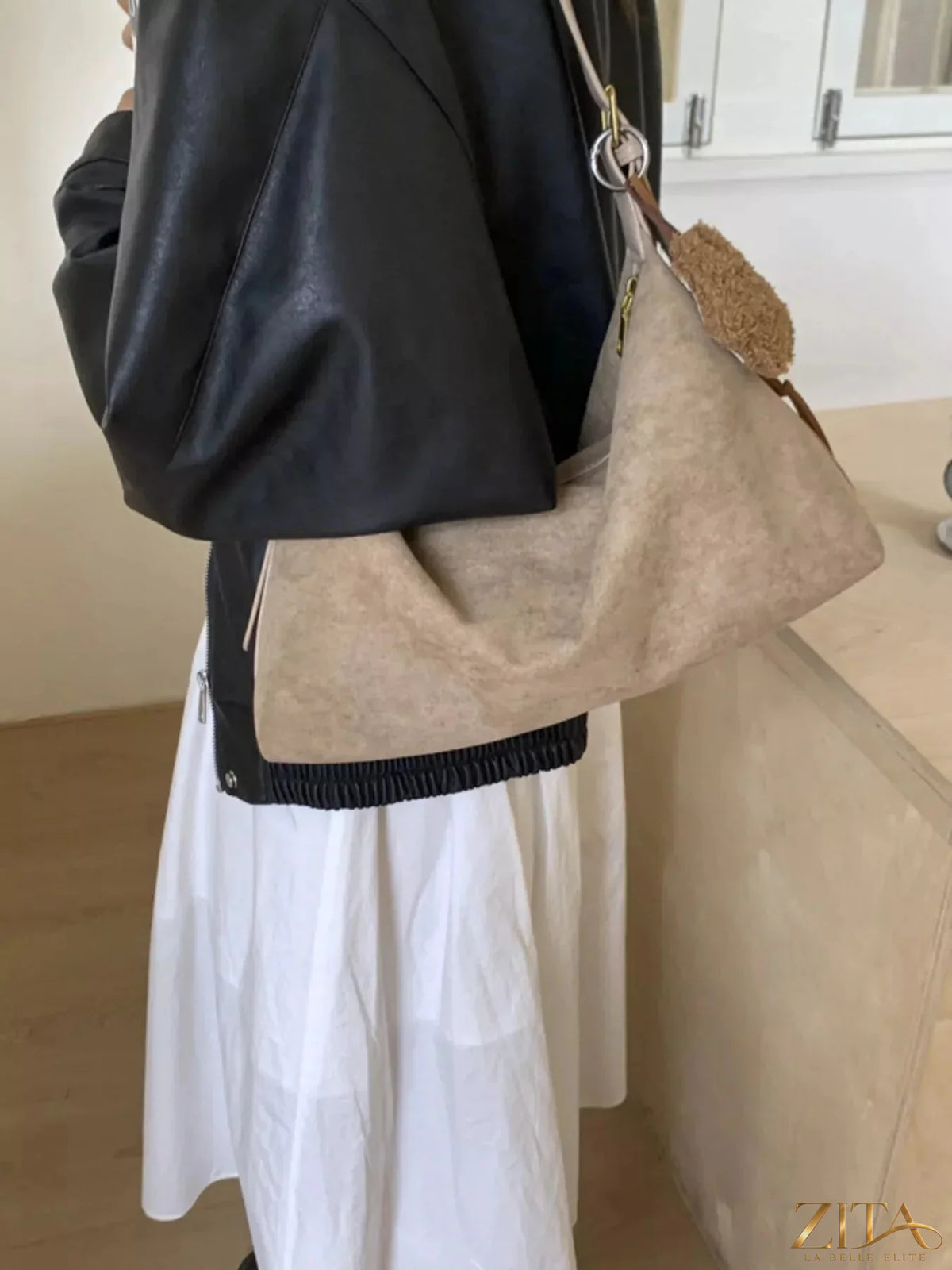 Zita La Belle Elite solid color suede hobo crossbody bag with a relaxed, slouchy design and adjustable strap.