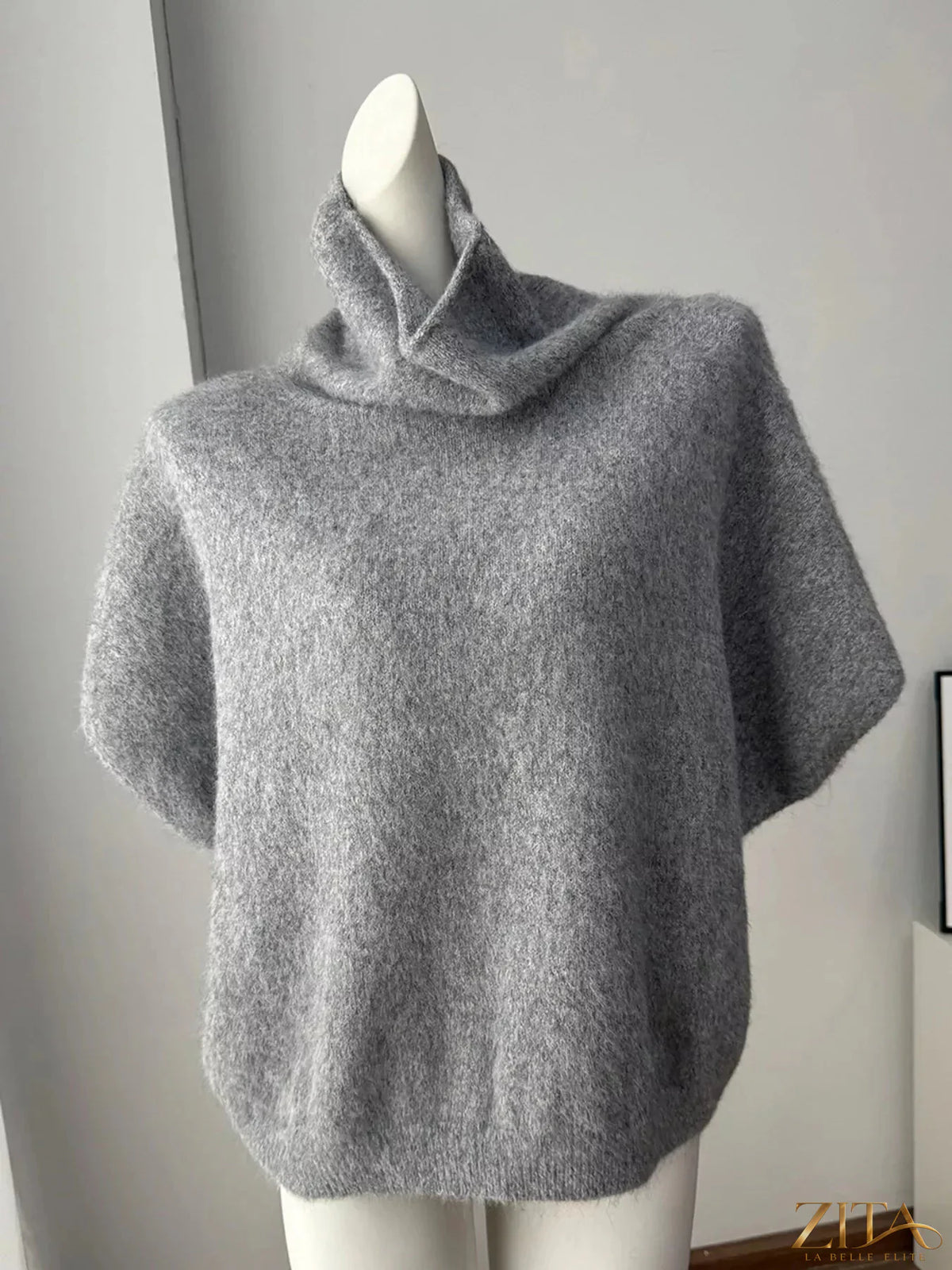 Zita La Belle Elite fuzzy short sleeve turtleneck sweater in cozy knit fabric, shown in a stylish, close-up view.