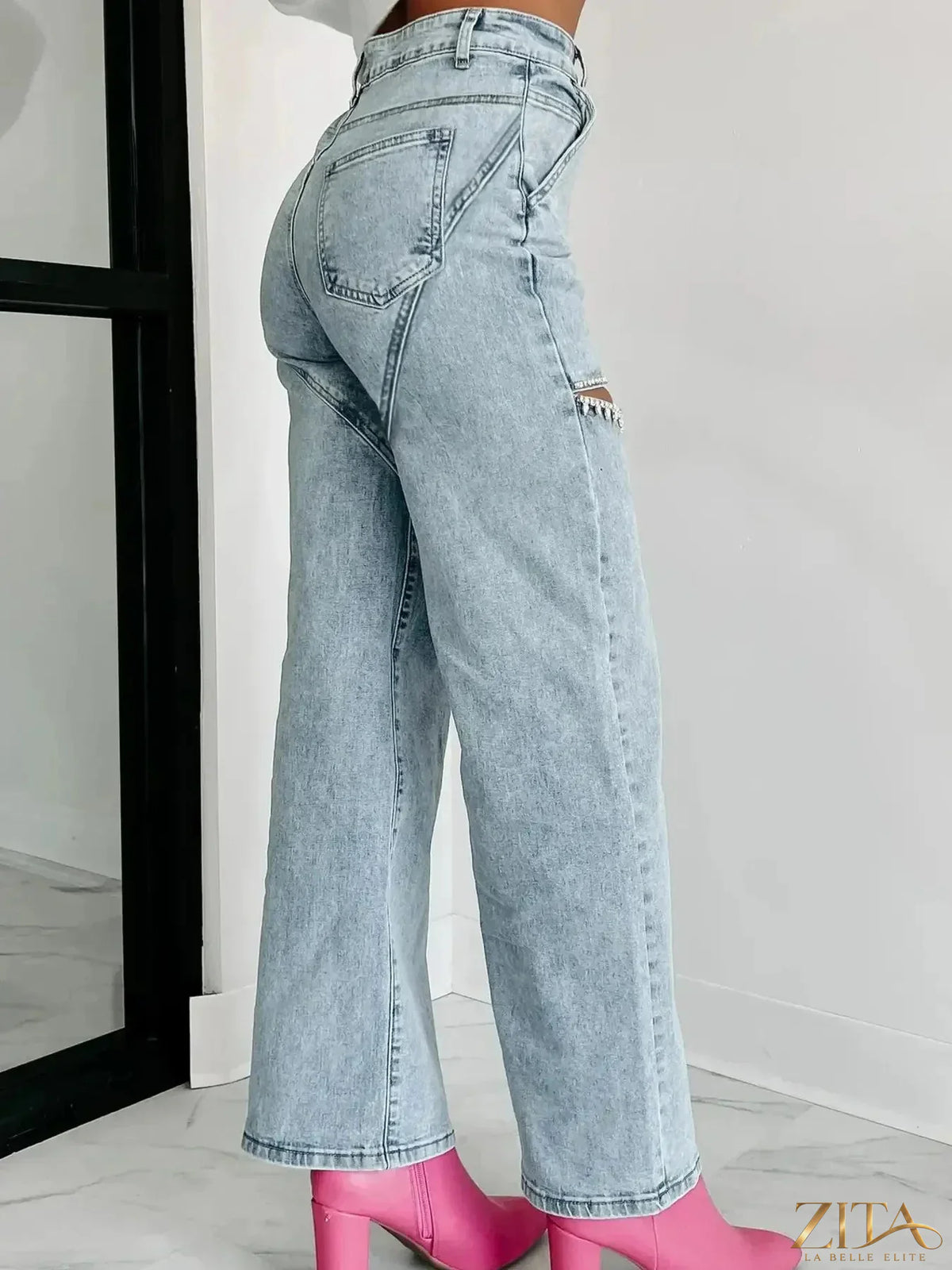 High waist cut-out wide leg jeans by Zita La Belle Elite featuring distressed details and a stylish, relaxed fit.