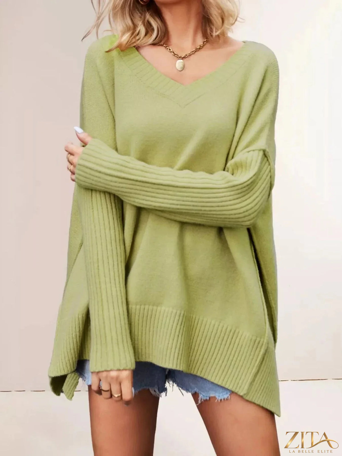 Zita La Belle Elite V-neck ribbed sleeve sweater in soft knit fabric, featuring a fitted V-neck and long ribbed sleeves.