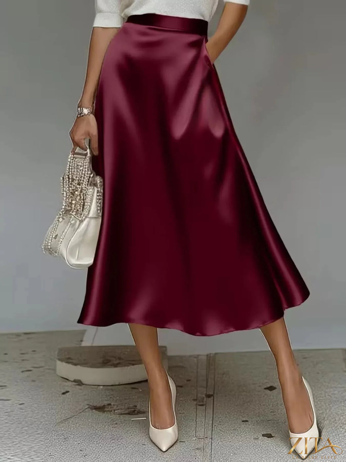 Zita La Belle Elite satin midi skirt in soft pink with a high waist and flowing silhouette, perfect for elegant evening wear.