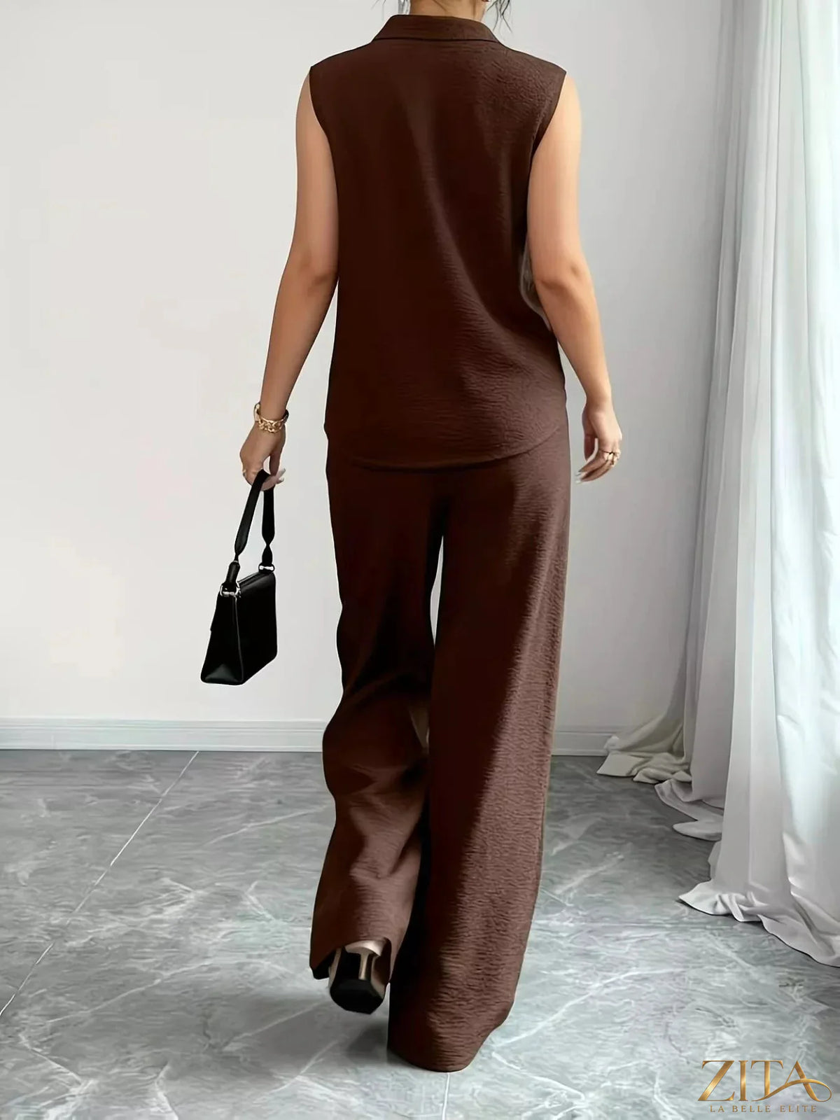 Zita La Belle Elite sleeveless top and wide-leg pants set in a stylish, modern design, shown on a model.