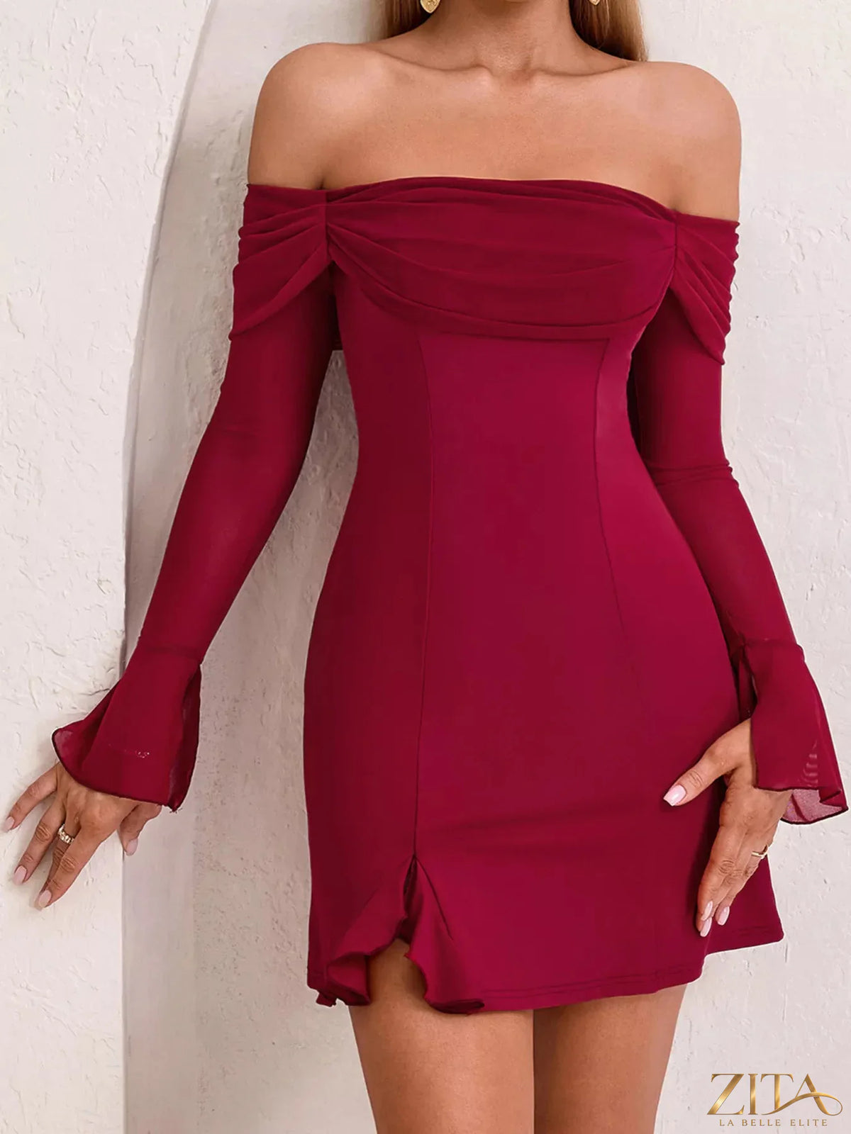 Off-shoulder long sleeve mini dress by Trendsi featuring a fitted silhouette and stylish neckline, perfect for casual or dressy occasions.