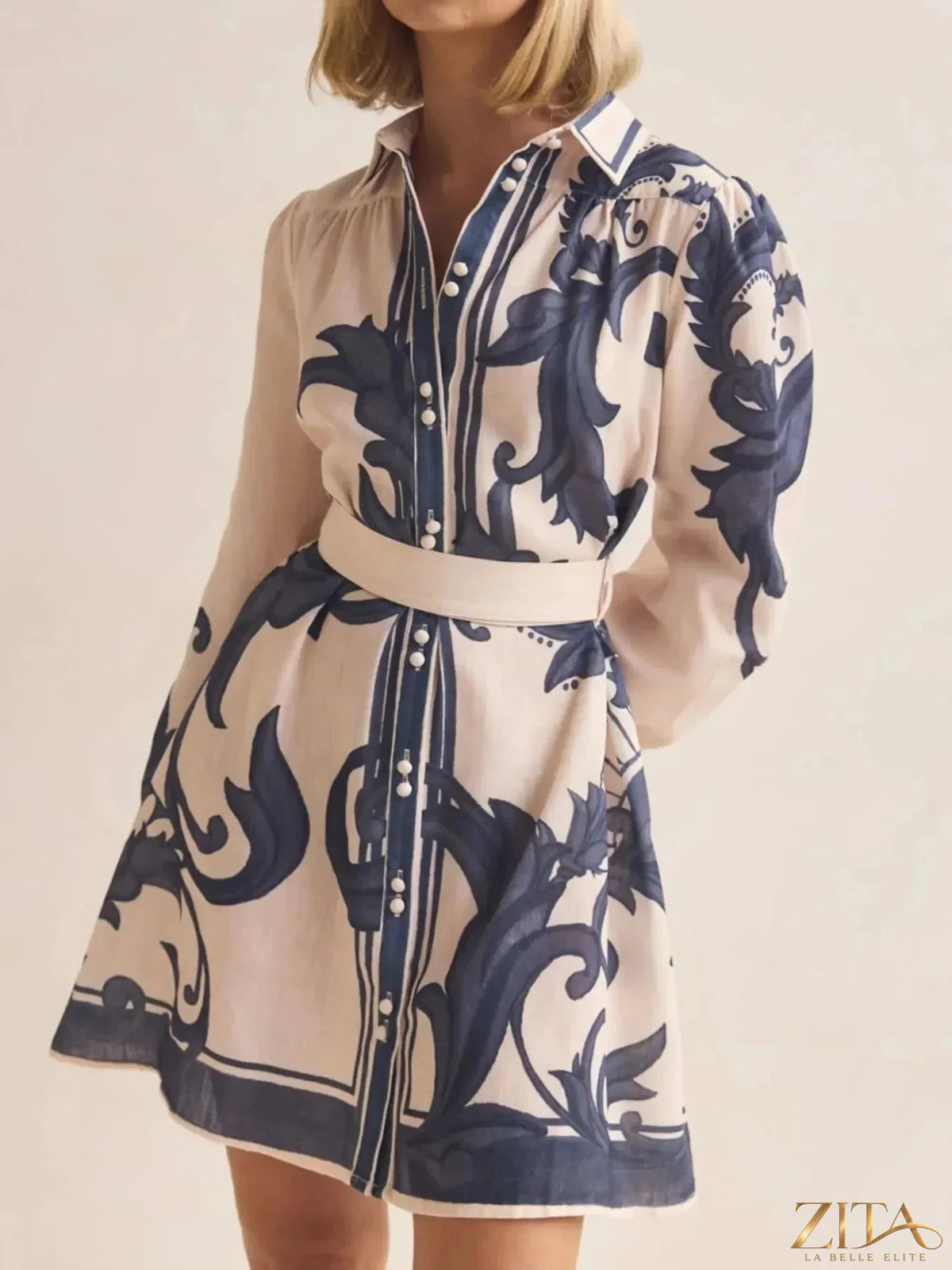 Printed long sleeve shirt dress from Trendsi featuring a stylish, casual design with a comfortable fit and trendy pattern.