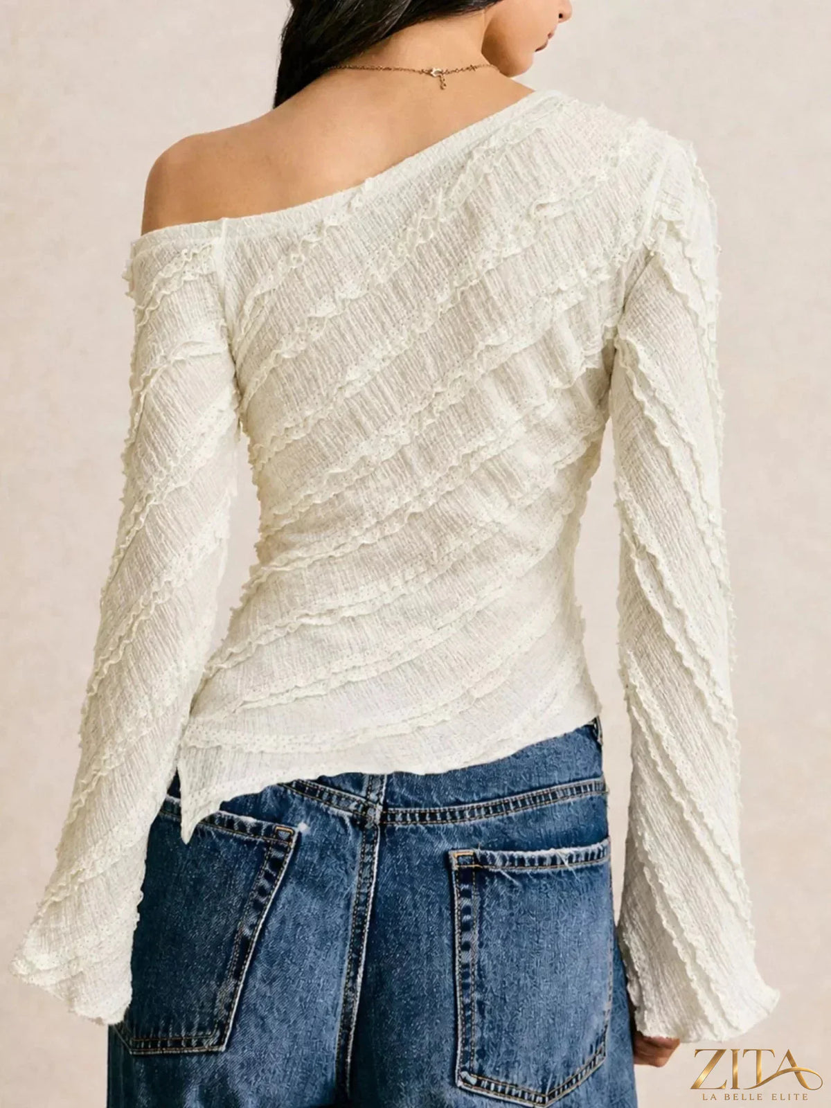 Textured asymmetrical hem one-shoulder blouse by Zita La Belle Elite, featuring a stylish design with unique fabric details.