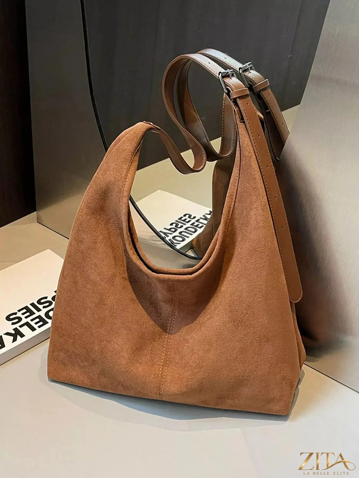 Lightweight Zita La Belle Elite adjustable strap handbag with structured design and neutral color, showing front view and strap details.