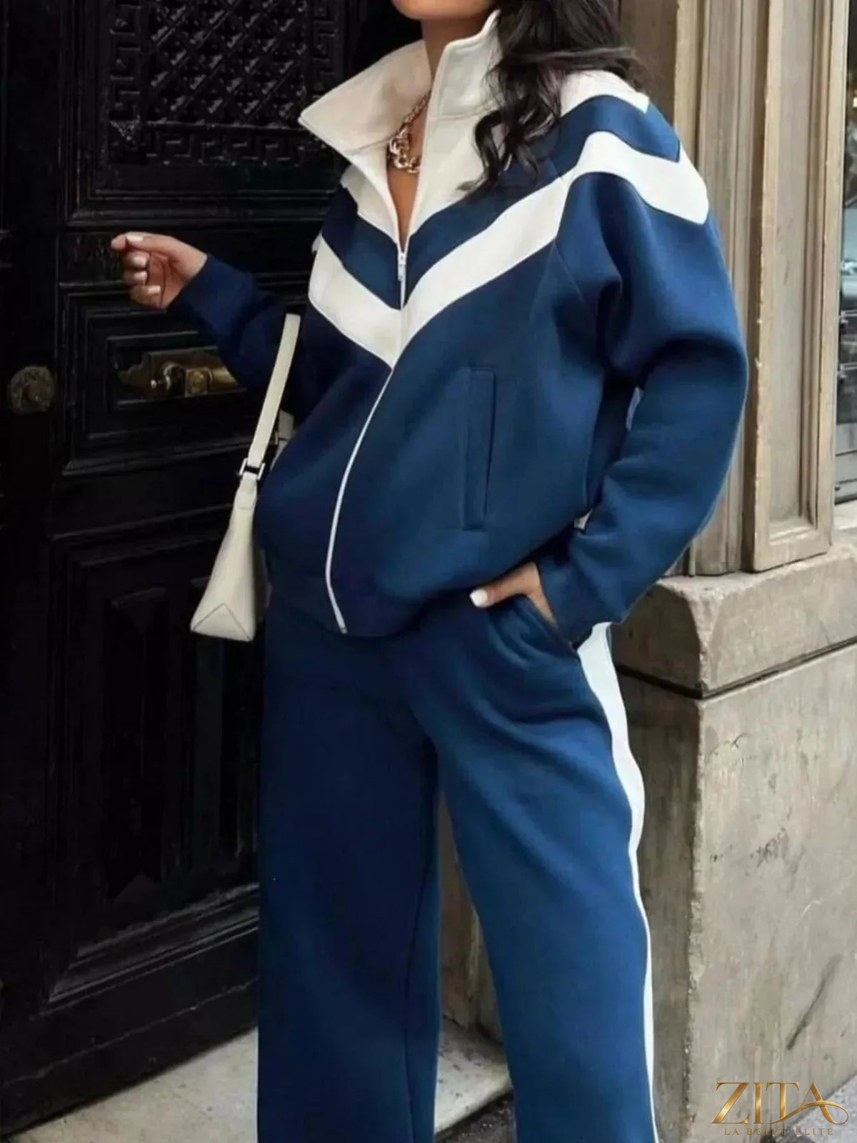 Zita La Belle Elite color block zip-up outerwear and matching pants set featuring vibrant contrasting panels and a stylish hood.