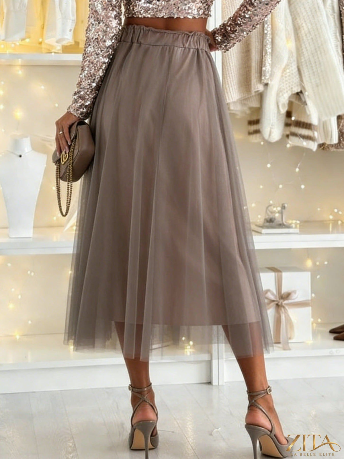 Light pink tulle A-line midi skirt by Trendsi with a flowy, layered design perfect for elegant, feminine outfits.