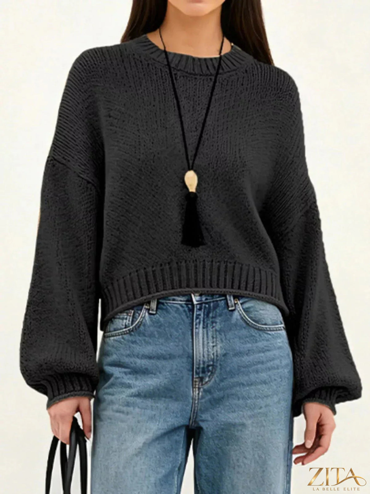 Oversized chunky knit sweater by Trendsi featuring thick yarn and relaxed fit, shown in a cozy, neutral-colored fabric.