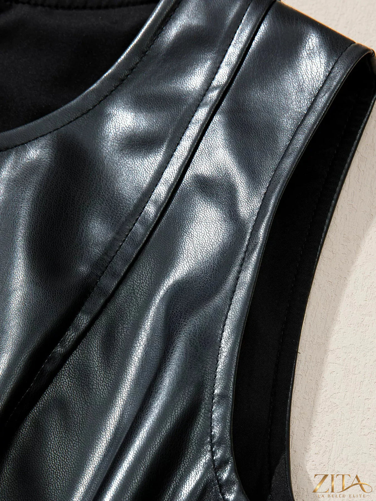 Zita La Belle Elite faux leather sleeveless mini dress with ruffle hem, stylish and fitted for a chic look