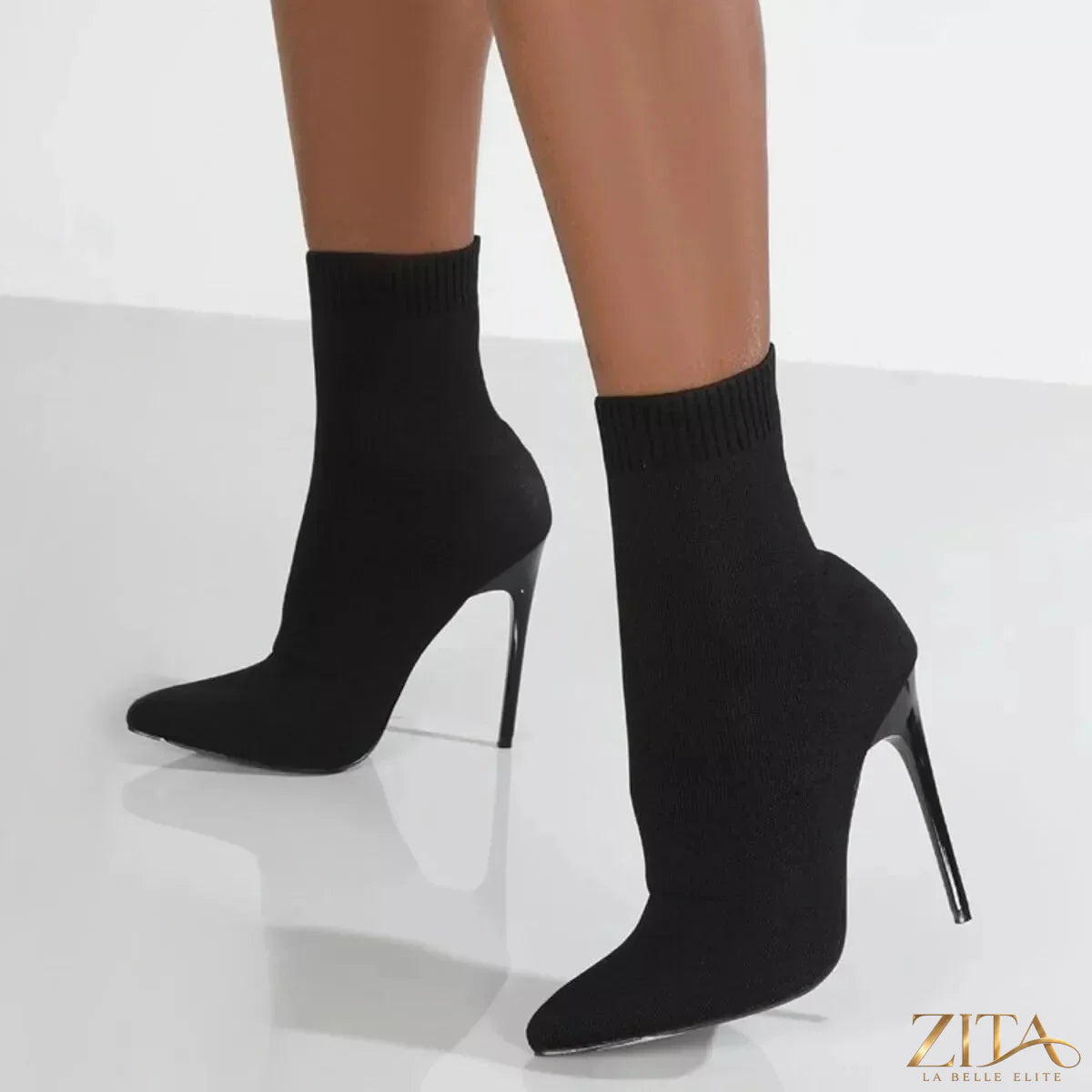 Black point toe stiletto boots by Zita La Belle Elite with sleek design and high heels, perfect for stylish evening wear.