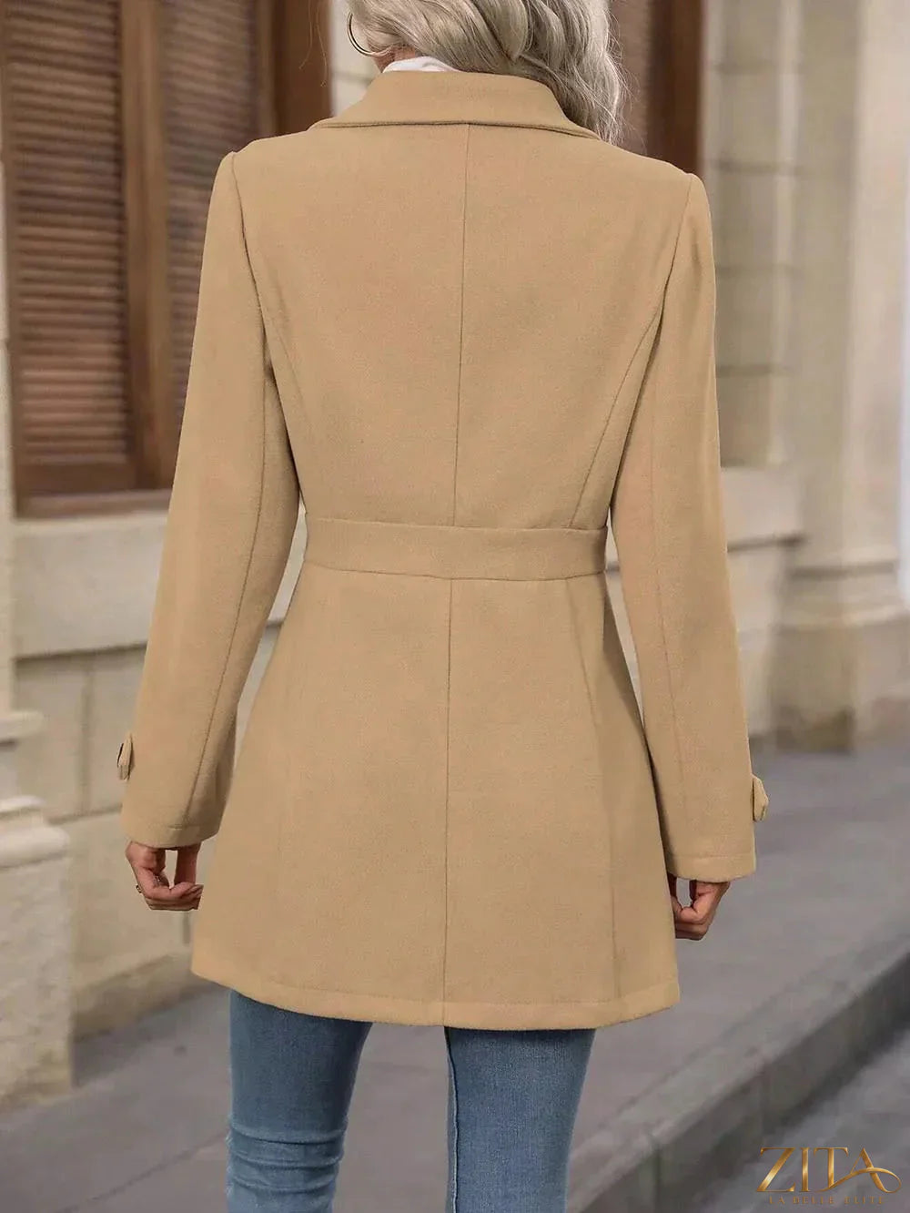 Zita La Belle Elite collared neck button-up coat displayed on a hanger, featuring a classic design with buttons and a structured silhouette.