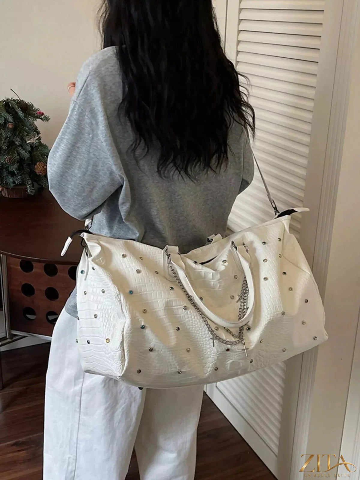 Large capacity Zita La Belle Elite travel bag with studded design, featuring multiple compartments and durable handles for travel.