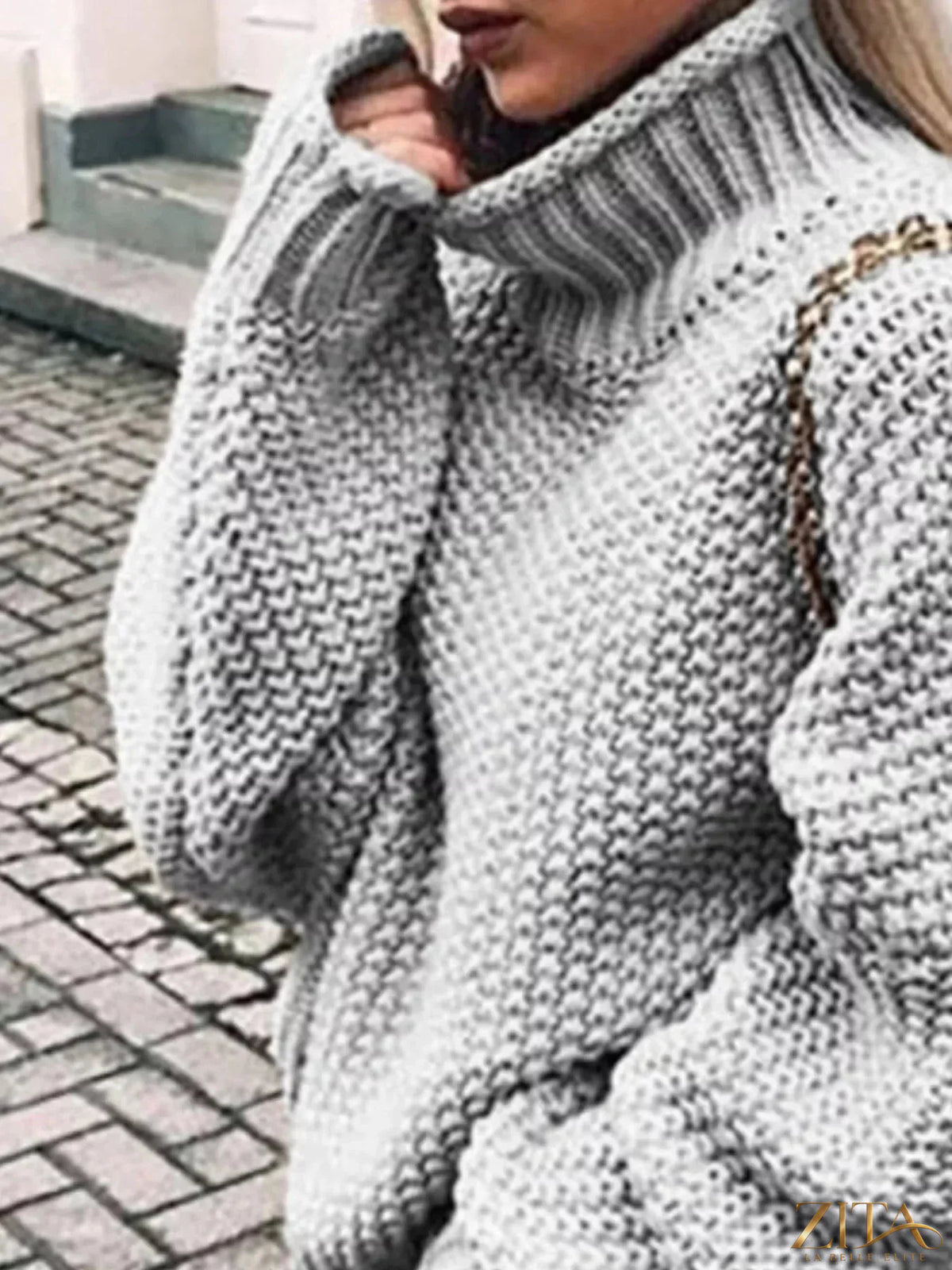 Zita La Belle Elite chunky knit turtleneck sweater in cozy cream with textured knit pattern and high collar.