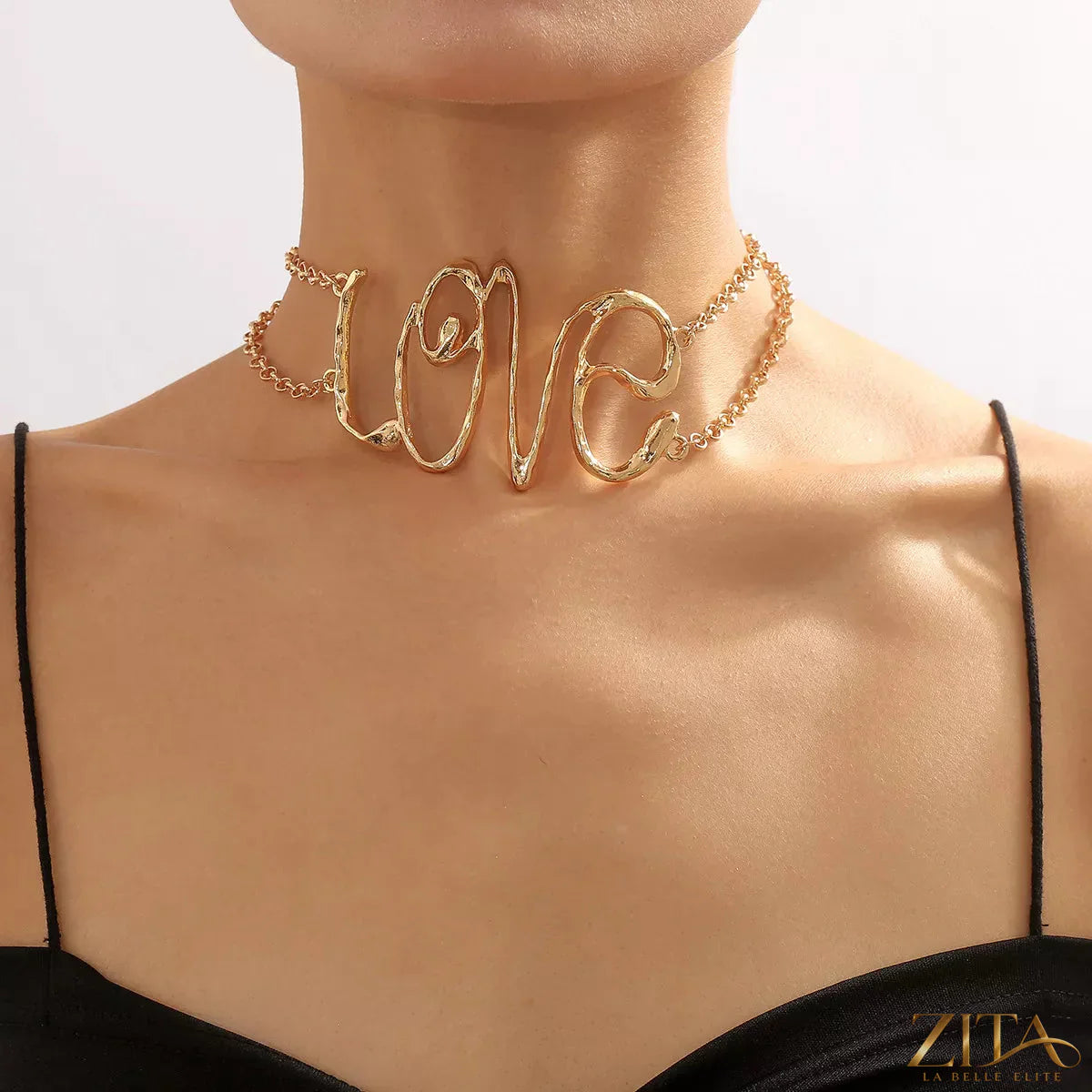 Gold wire love script necklace by Zita La Belle Elite featuring a delicate, elegant love pendant on a fine chain.