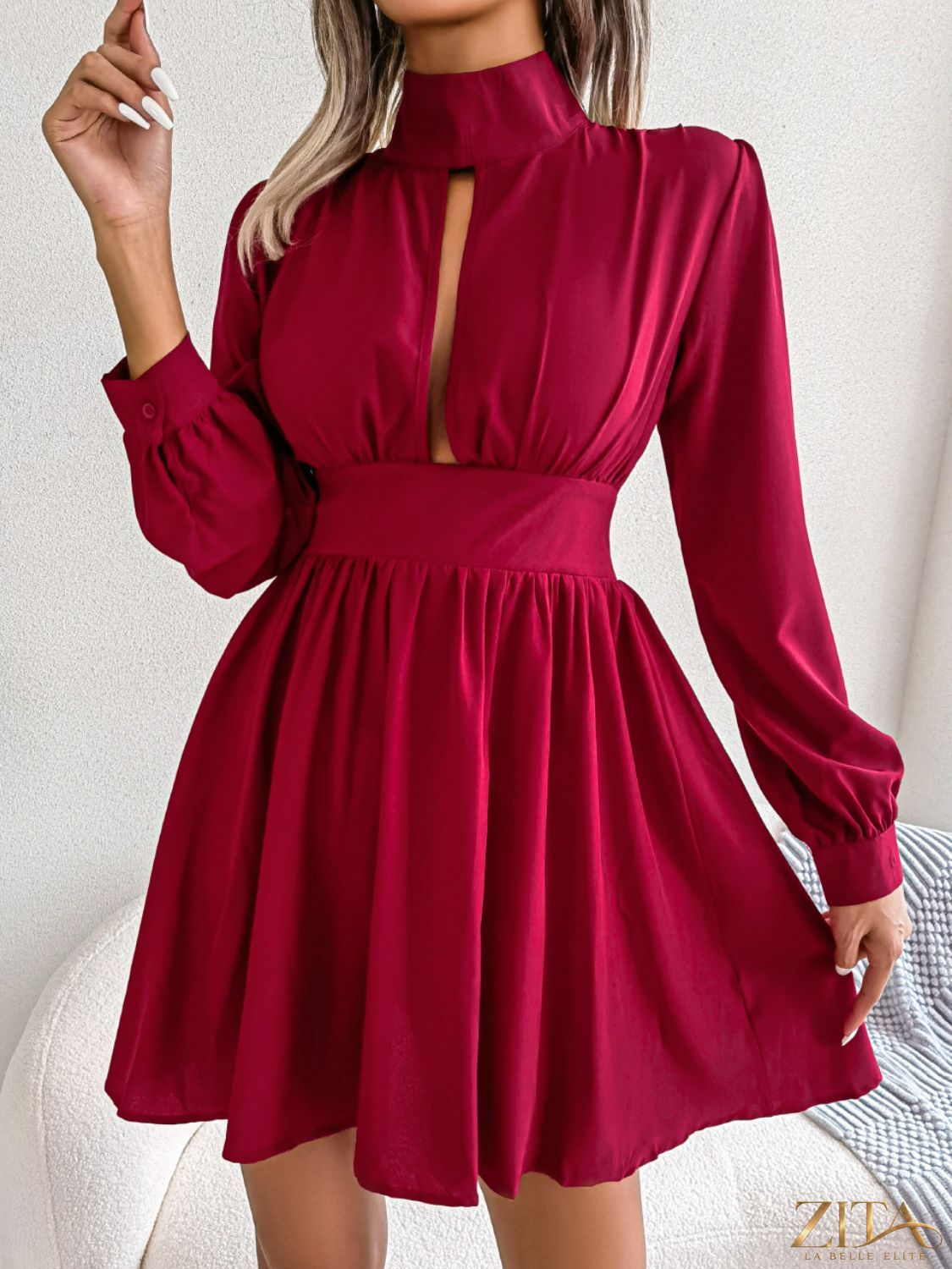 Black cutout turtleneck A-line mini dress from Trendsi featuring a fitted silhouette and stylish design.