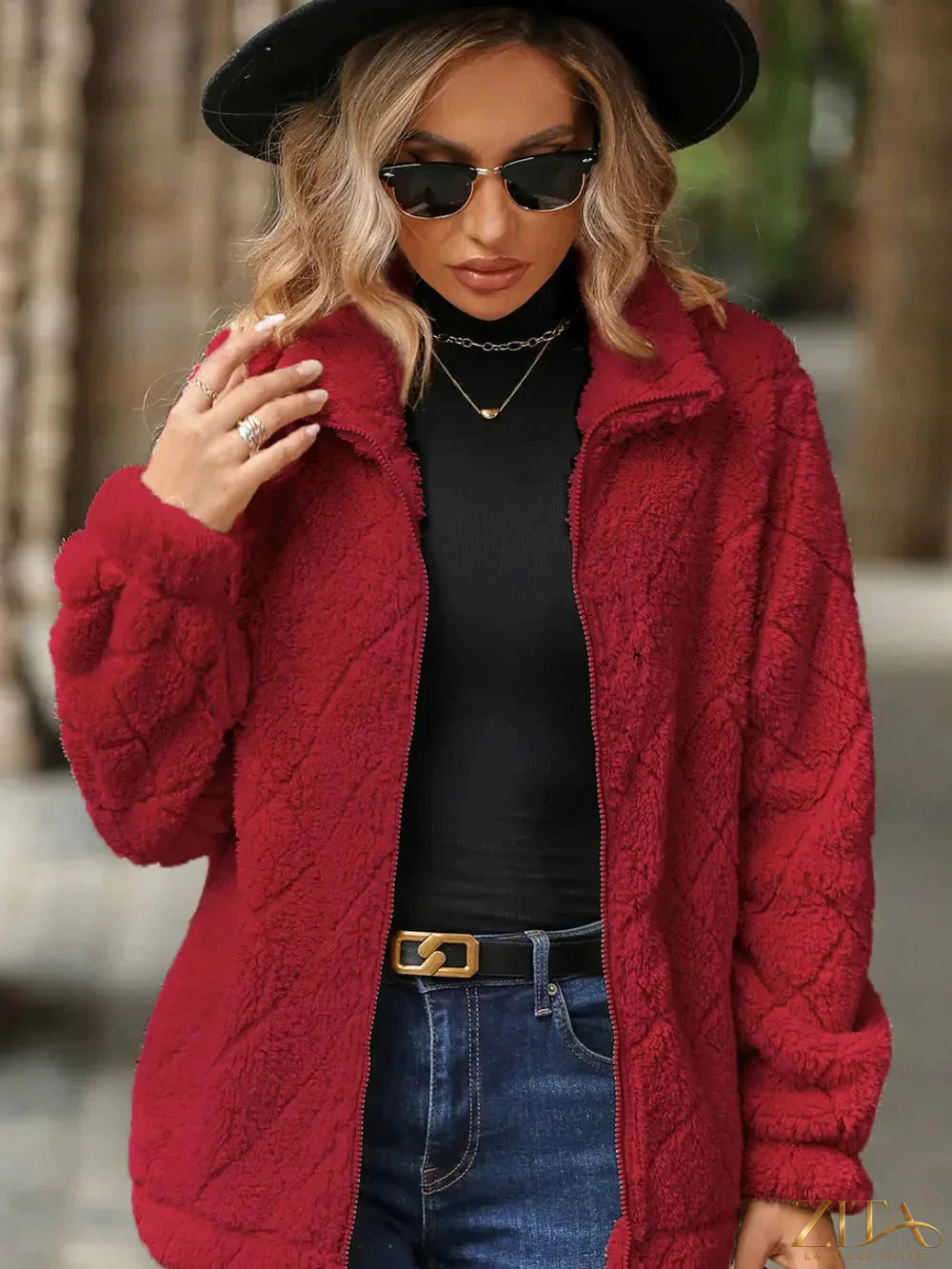 Zita La Belle Elite fuzzy pocketed zip-up jacket in soft fabric with front pockets and a full zipper closure.