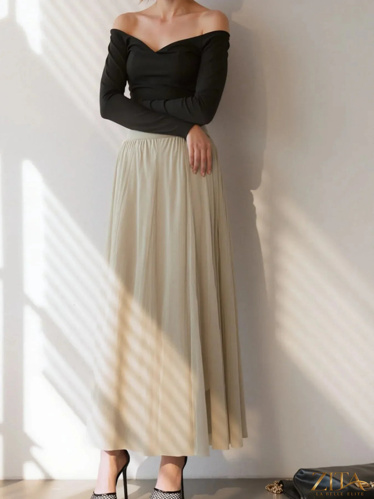 High-waisted midi skirt by Trendsi, featuring a flowing fabric and stylish design, shown in a full-length view.