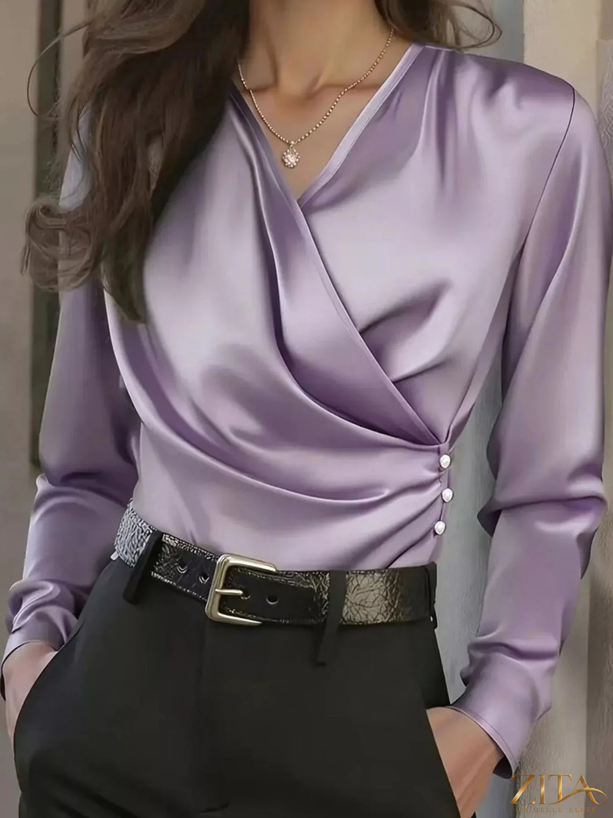 Zita La Belle Elite satin surplice long sleeve blouse with V-neck and elegant draping, shown in a stylish fashion image.