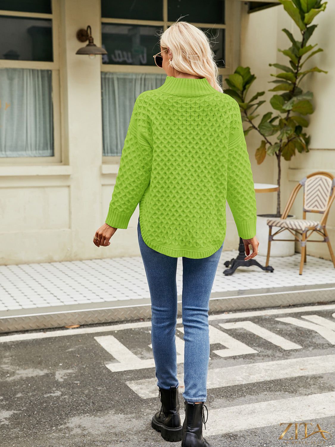 Zita La Belle Elite mock neck slit sweater in soft knit fabric, featuring a stylish high neckline and side slit detail.
